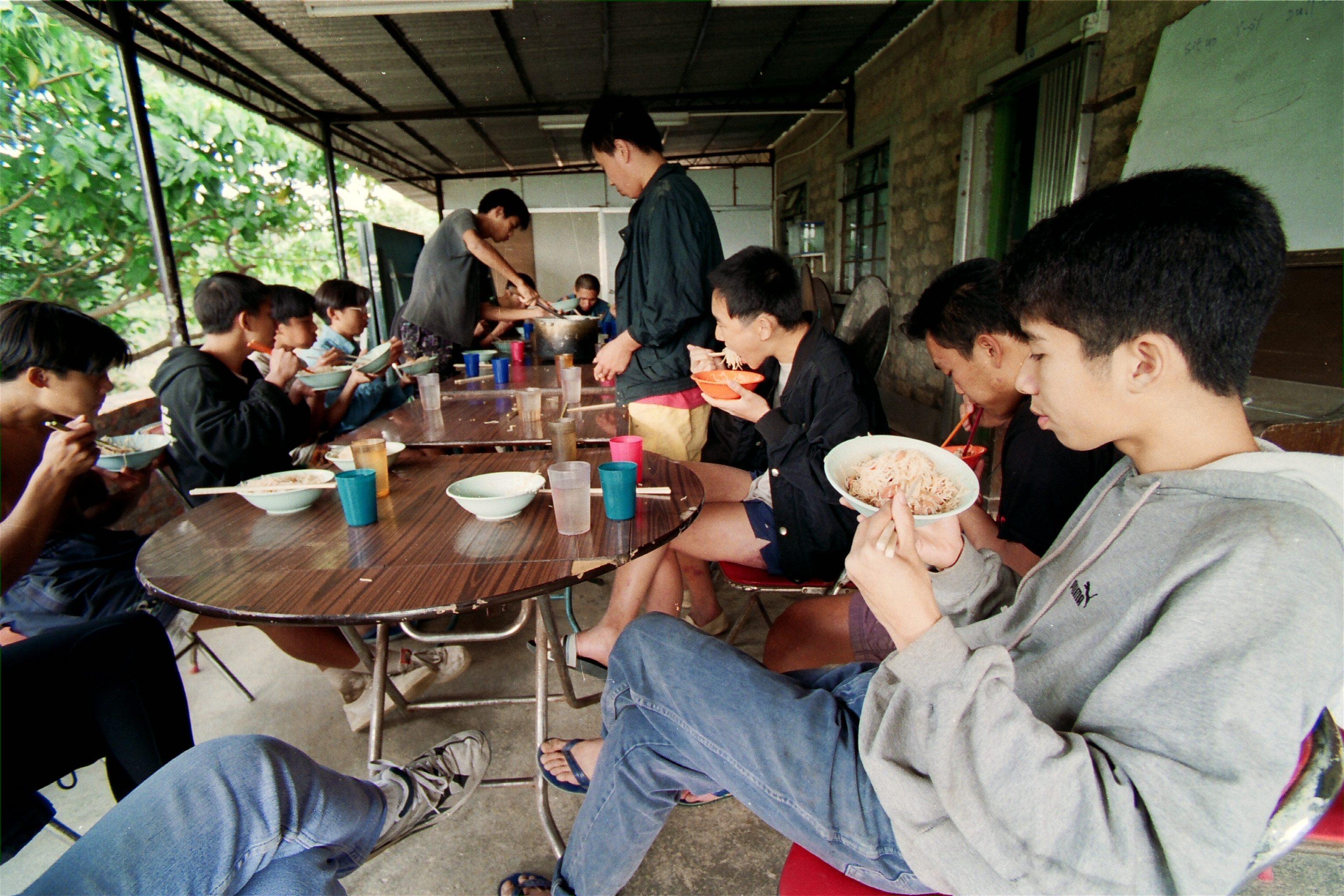 Teenage drug addicts having a meal together in a drug treatment centre run by the Christian Zheng Sheng Association on Lantau Island. The decades-old charity is reeling from a scandal that has seen four directors arrested. Photo: SCMP Pictures