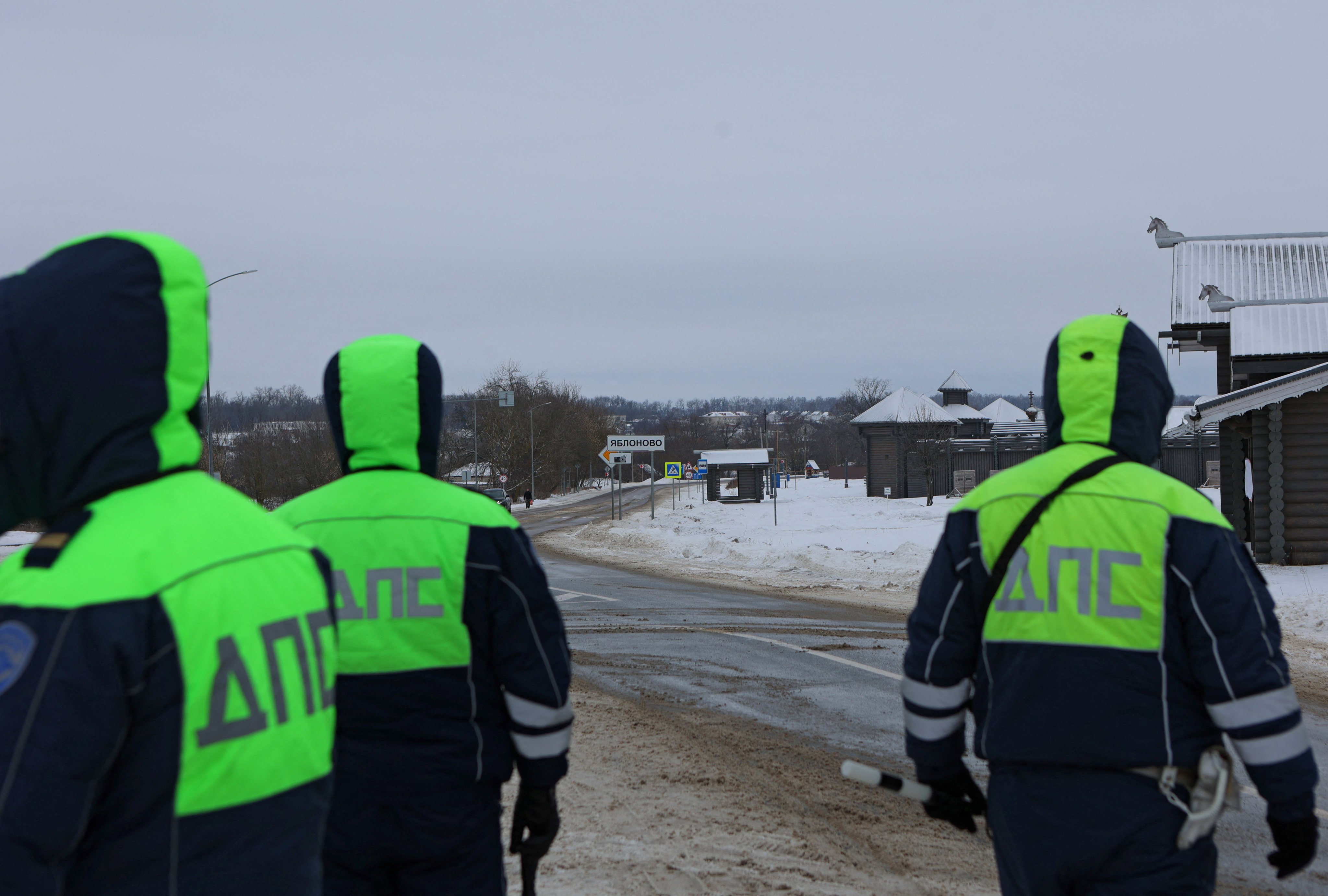 Traffic police officers block off a road near the crash site of the Russian Ilyushin Il-76 military transport plane on Wednesday. Photo: Reuters