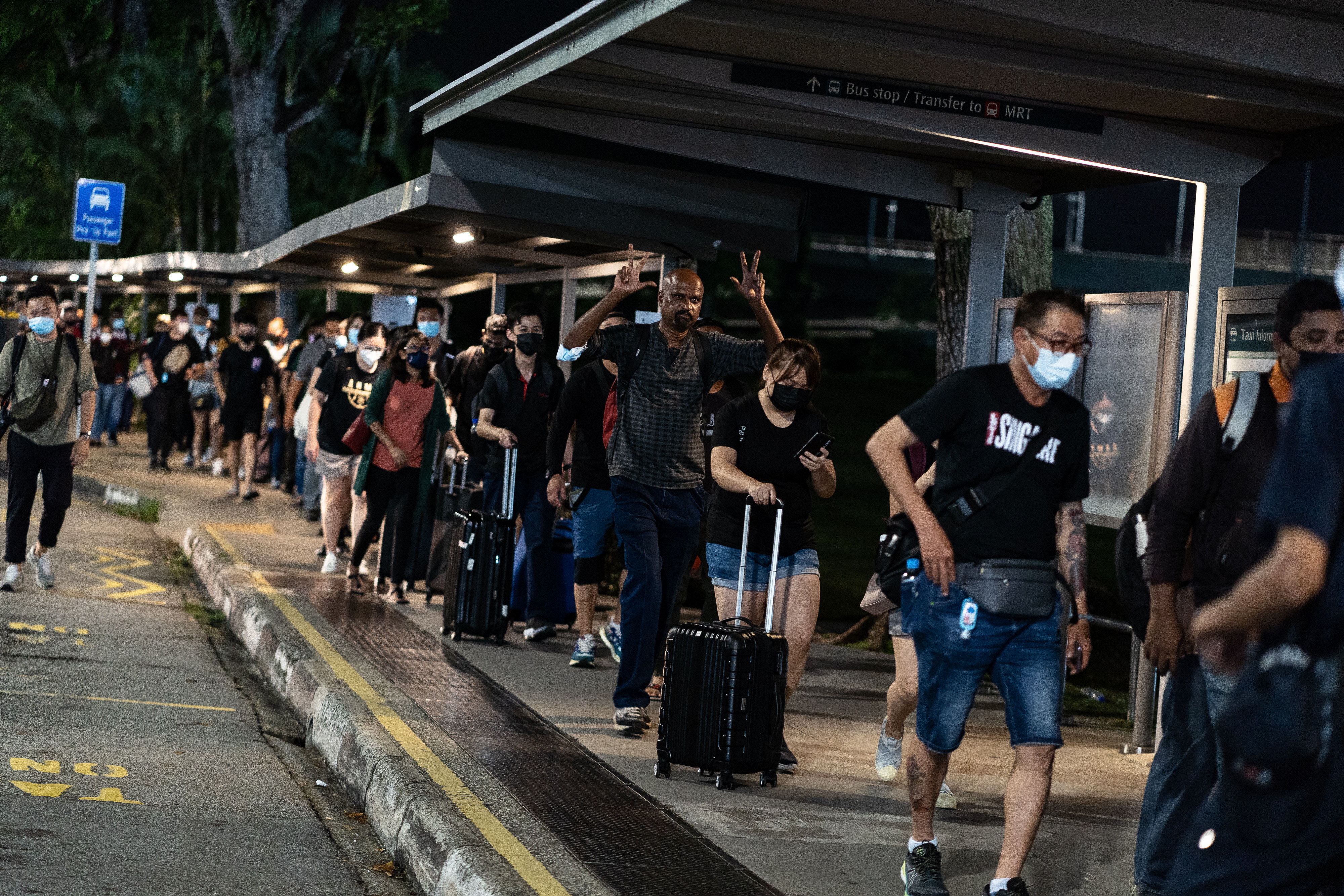 People queue up at Woodlands Checkpoint to cross the Singapore-Malaysia border at the stroke of midnight for the first time in two years, in 2022. Photo: Getty Images
