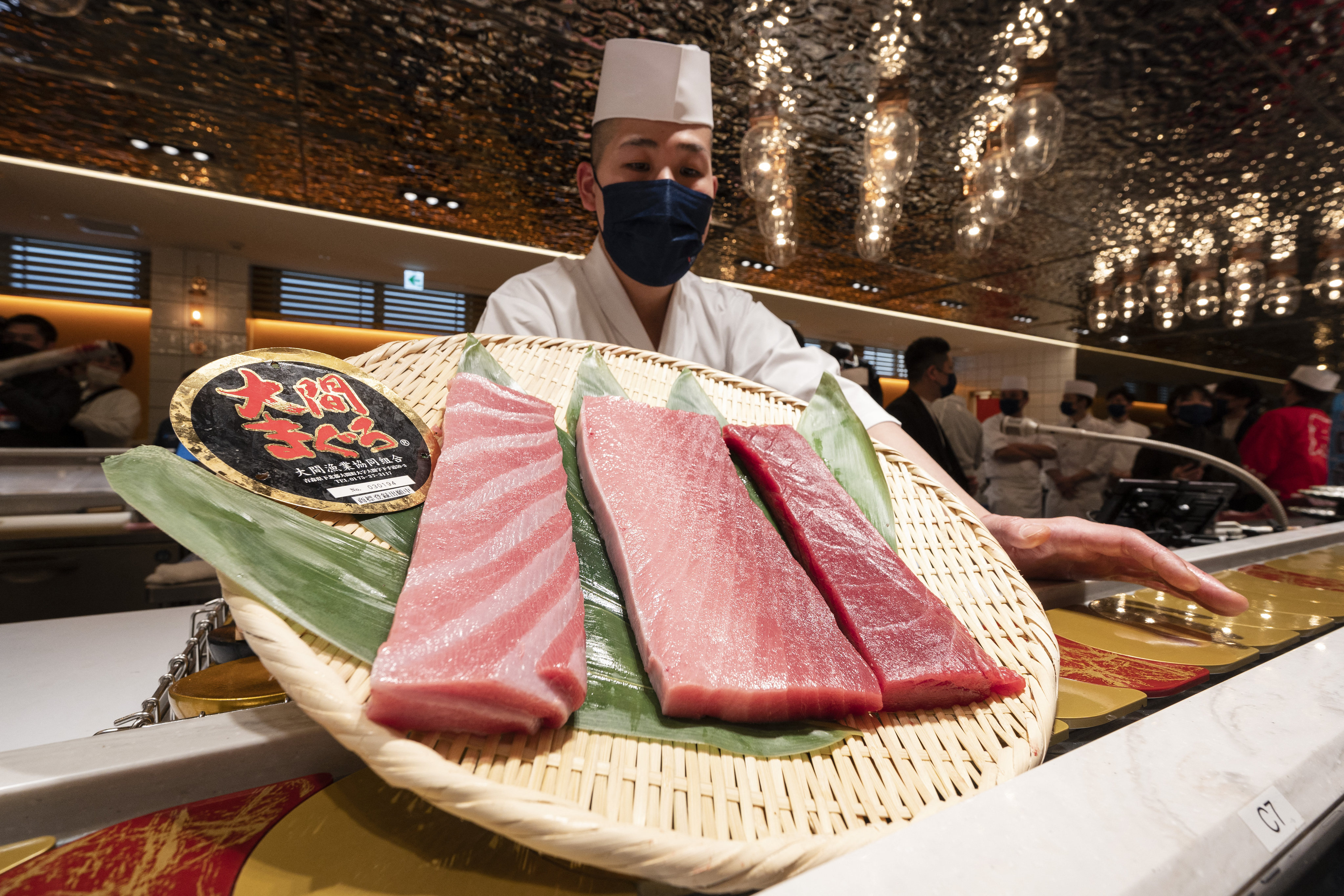 A Japanese sushi chef displays freshly cut bluefin tuna. Photo: AFP 