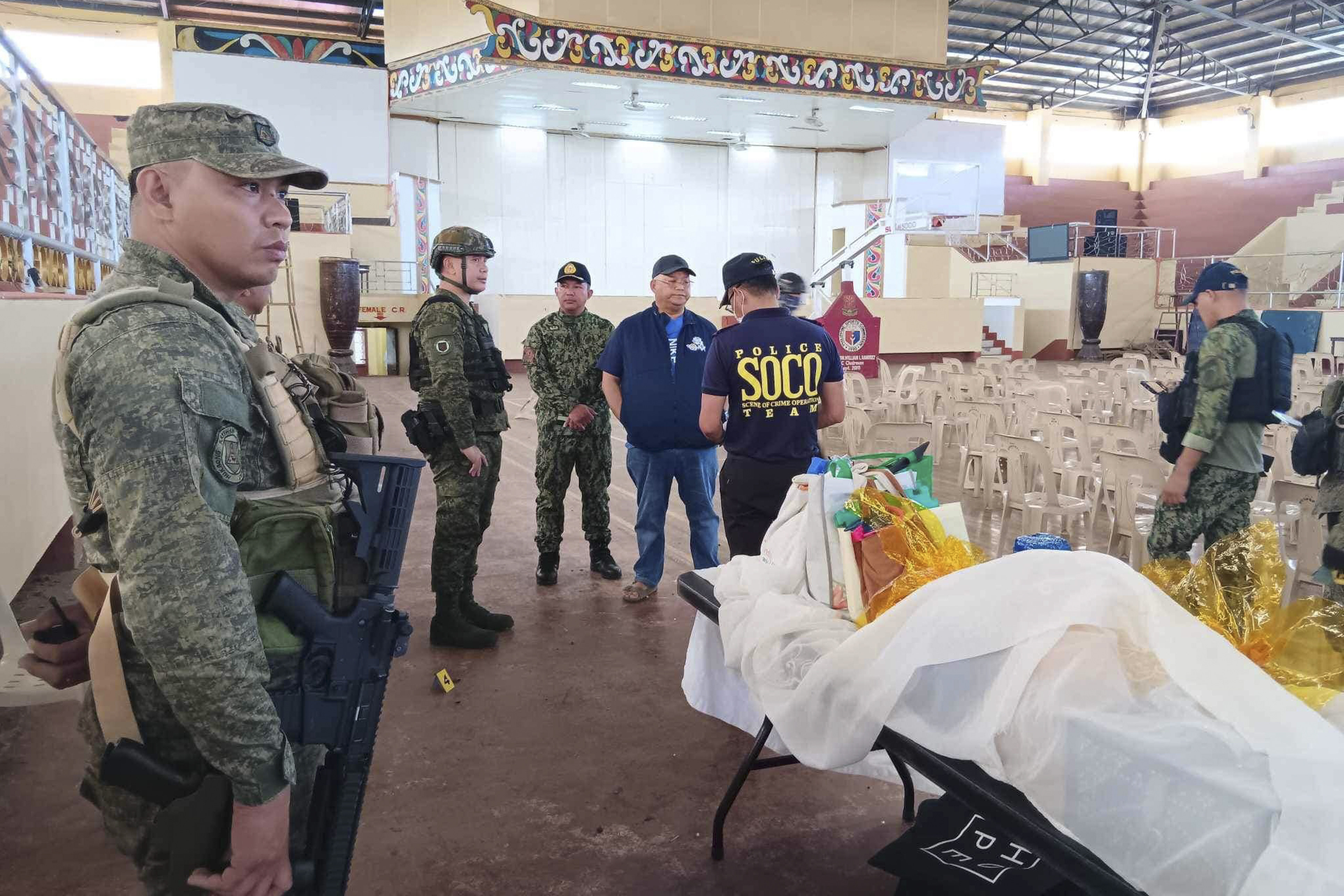 Law enforcers investigate at the site of a fatal explosion during a Catholic Mass in the southern Philippines in December. Photo: AP