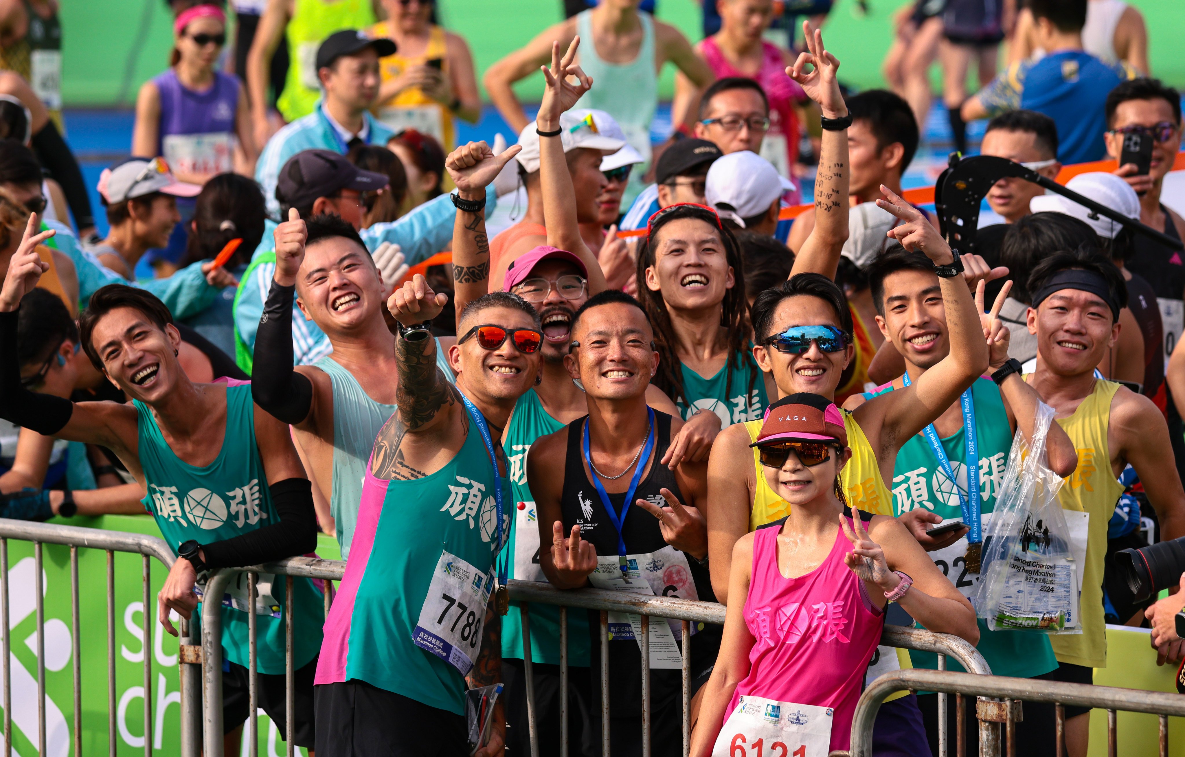 Runners arrive at Standard Chartered Hong Kong Marathon 2024 finish line at Victoria Park, Causeway Bay on January 21, 2024. Photo: May Tse