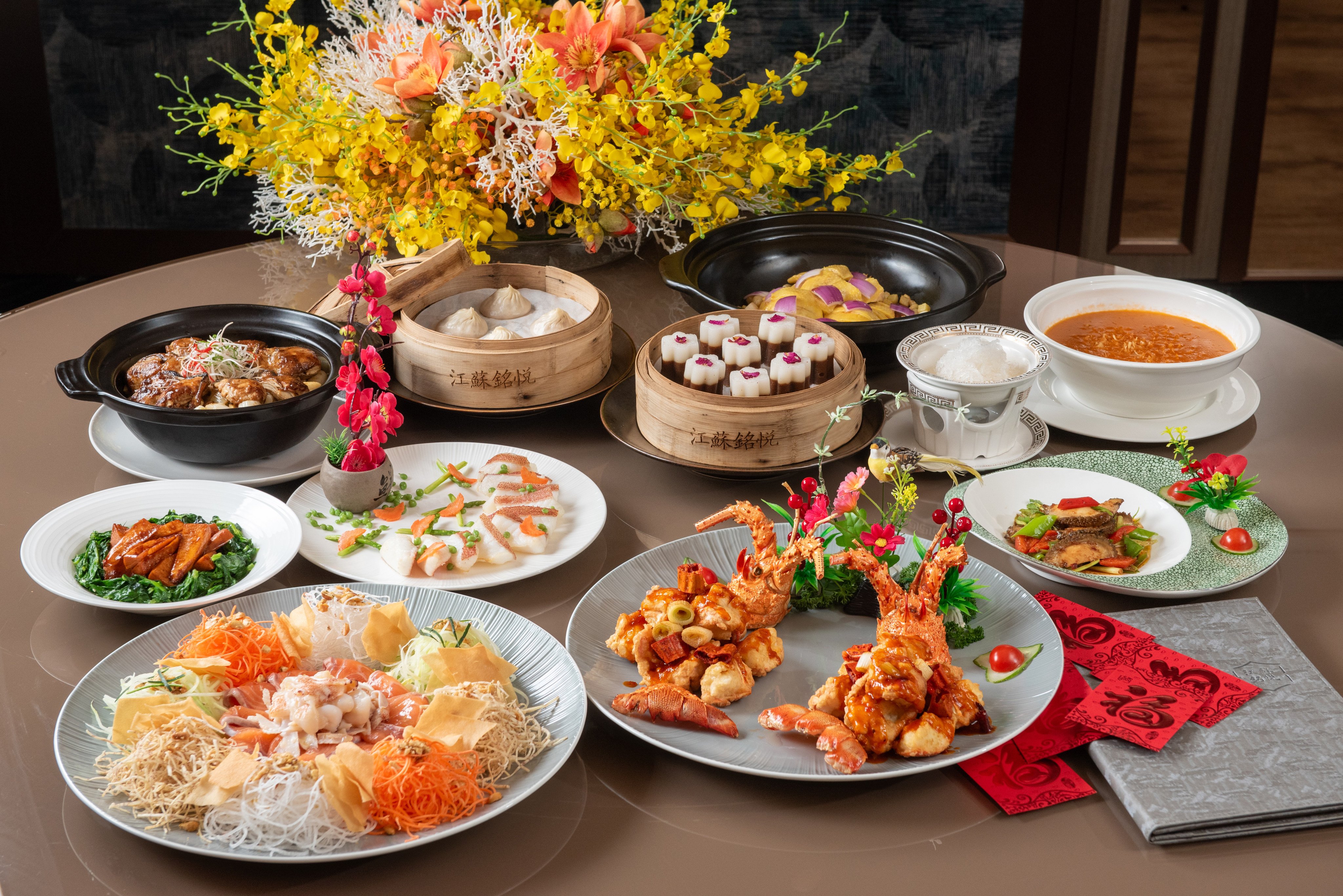 Dishes from Jiangsu Club’s Chinese New Year set meal for eight, including the “lo hei” tossed salad (front) for prosperity. It is one of 10 holiday dining options in Hong Kong we have picked out. Photo: Jiangsu Club