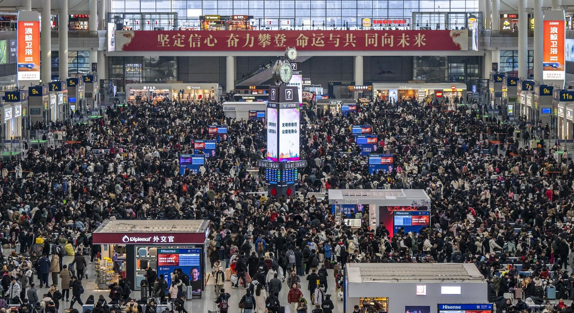Travellers gather at Shanghai Hongqiao railway station on Friday, the first day of China’s Lunar New Year travel period. Photo: Bloomberg