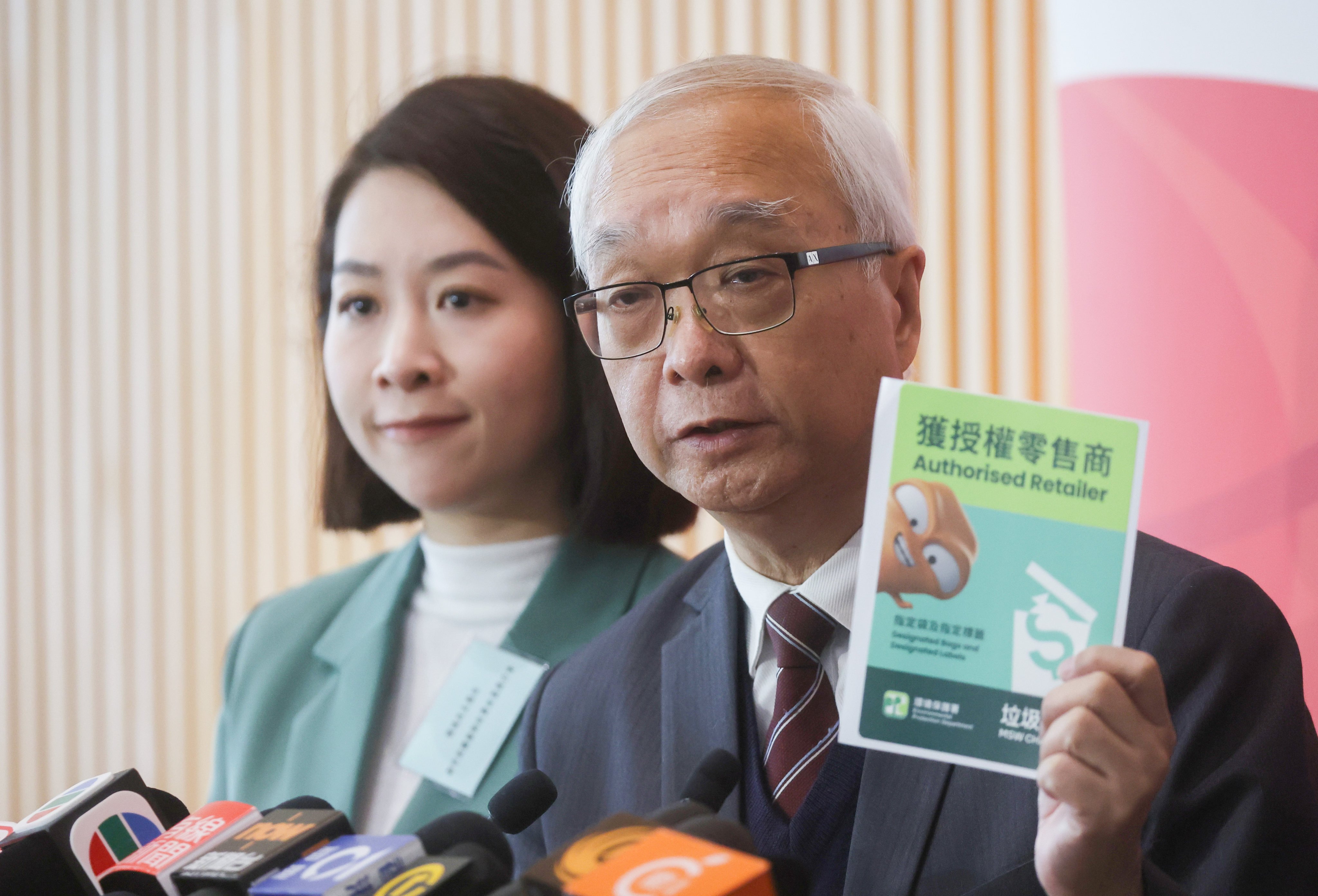 Kwai Tsing District Council member Jody Kwok Fu-yung (left) and Secretary for Environment and Ecology Tse Chin-wan meet the media after a briefing on municipal solid waste charging, at the government headquarters in Tamar on January 26. Tse has explained that the waste charging scheme is not about the money, but the way residents dispose of their rubbish. Photo: Edmond So