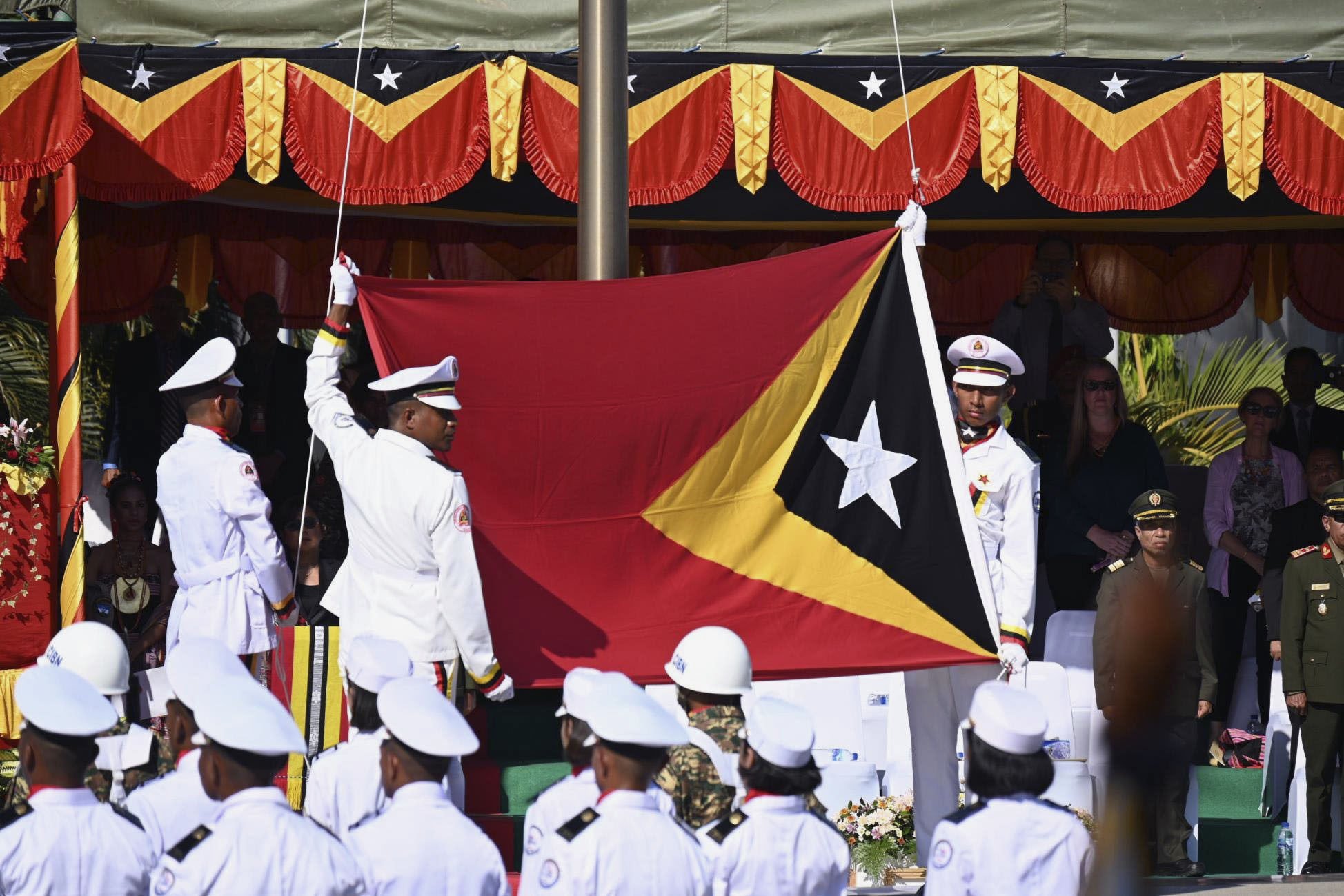 East Timor’s national flag is about to be raised in Dili in 2022, during a ceremony marking its 20th anniversary of independence.  Photo: Kyodo