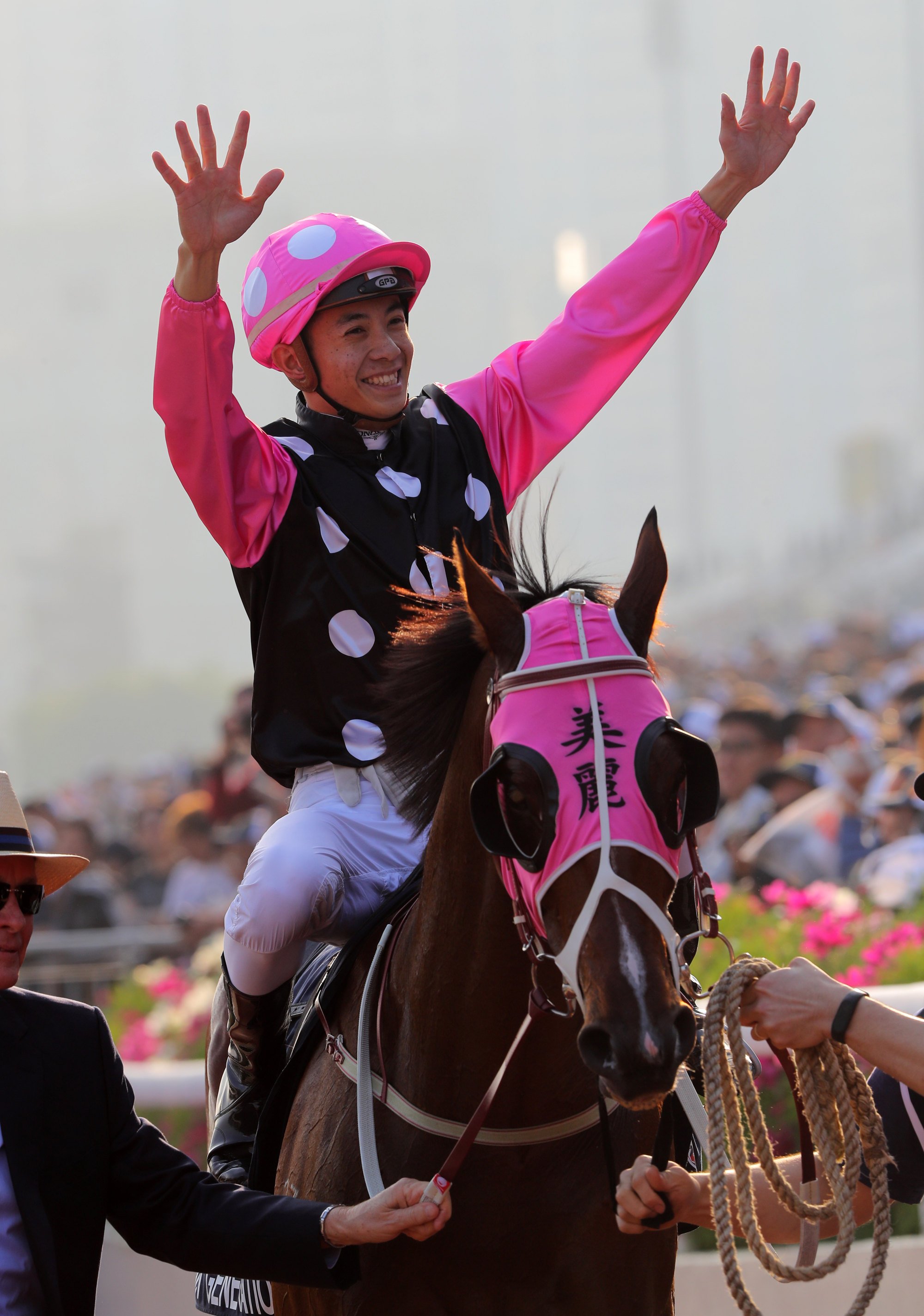 Derek Leung celebrates his win aboard Beauty Generation in the 2017 Hong Kong Mile.