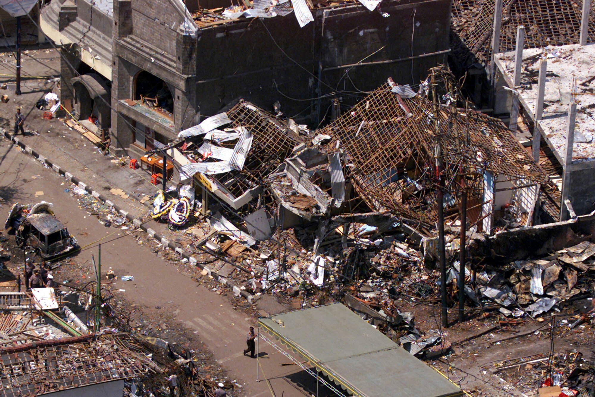 The wreckage of the Sari Club and surrounding buildings are seen on October 15, 2002 in Kuta, Bali, Indonesia. The bombings killed 202 people and injured another 200. Photo: AP