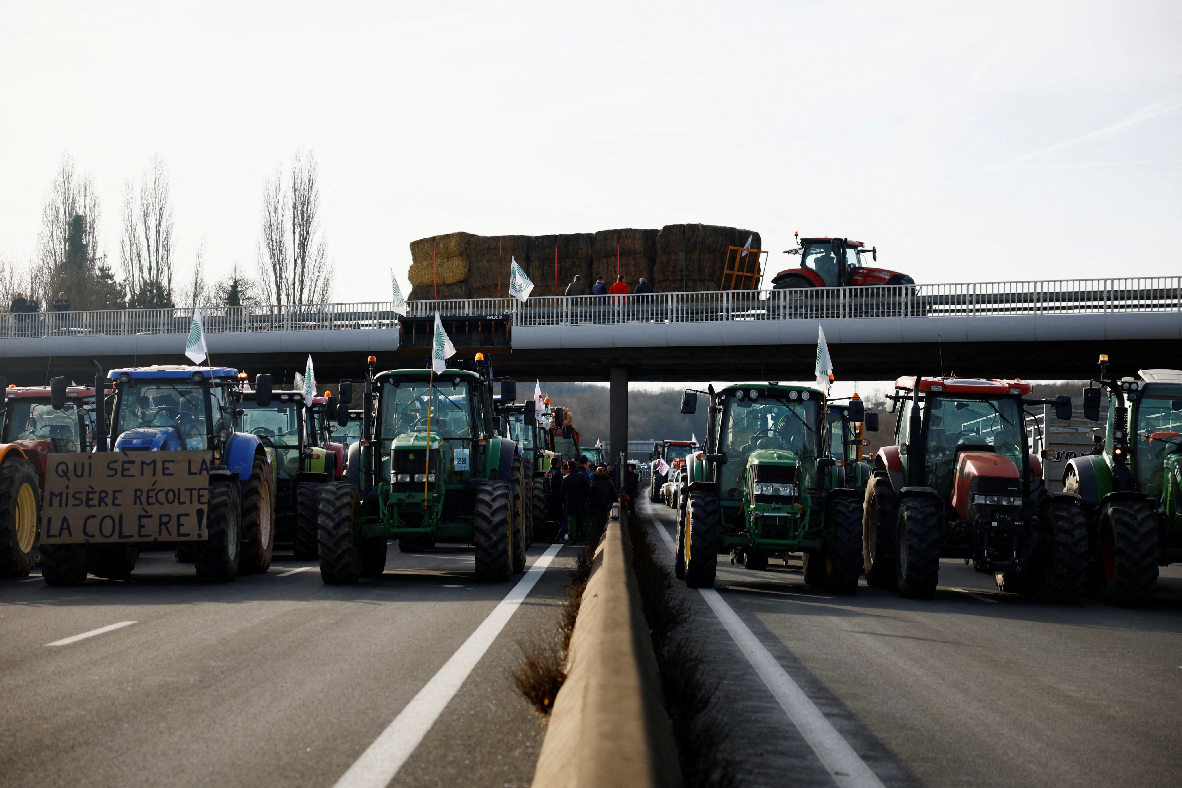 French farmers block a highway with their tractors in Longvilliers, near Paris. Photo: Reuters
