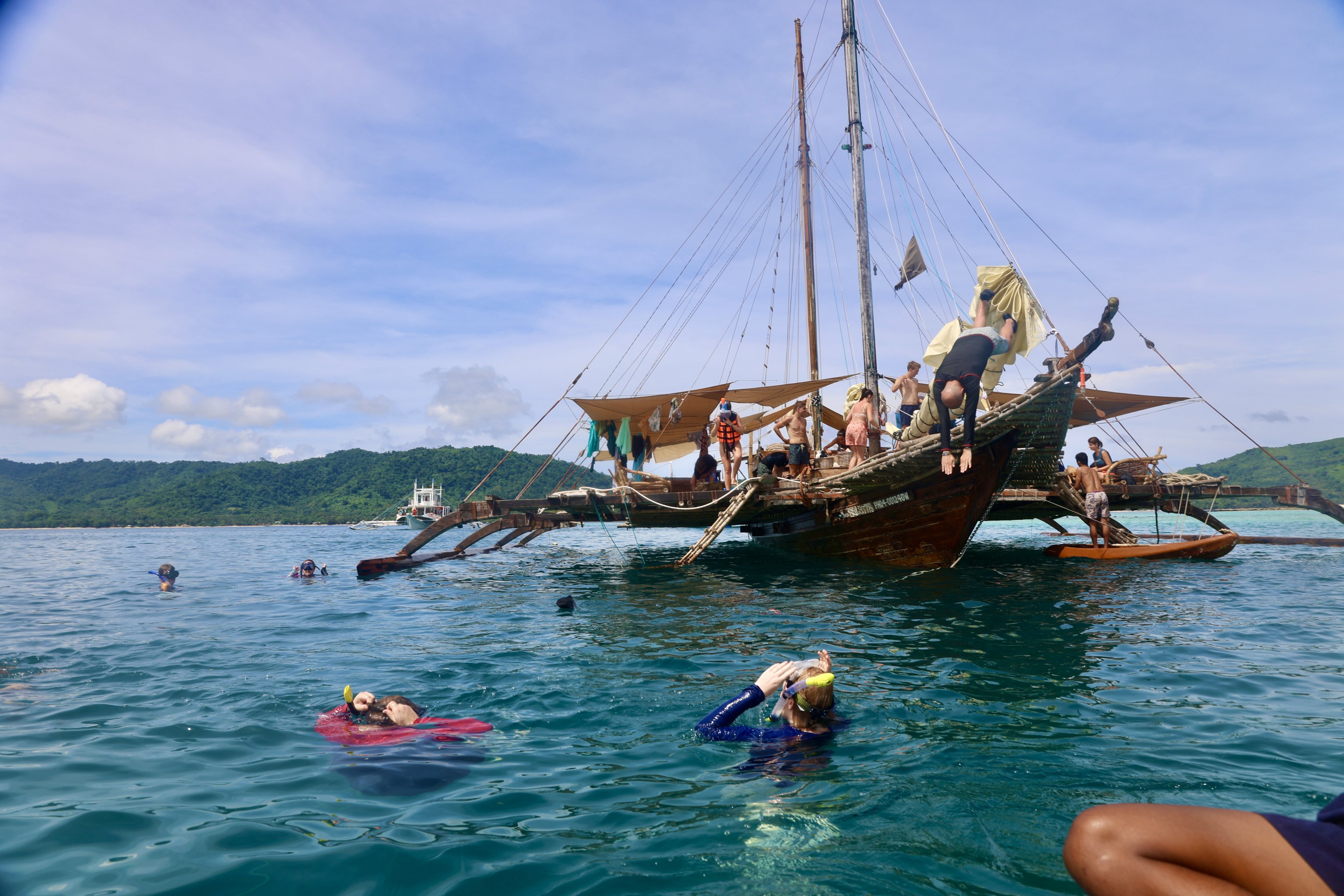 Guests snorkel around the Balatik, anchored off of Darocotan Island in Palawan, Philippines. Photo: Jordan Winters