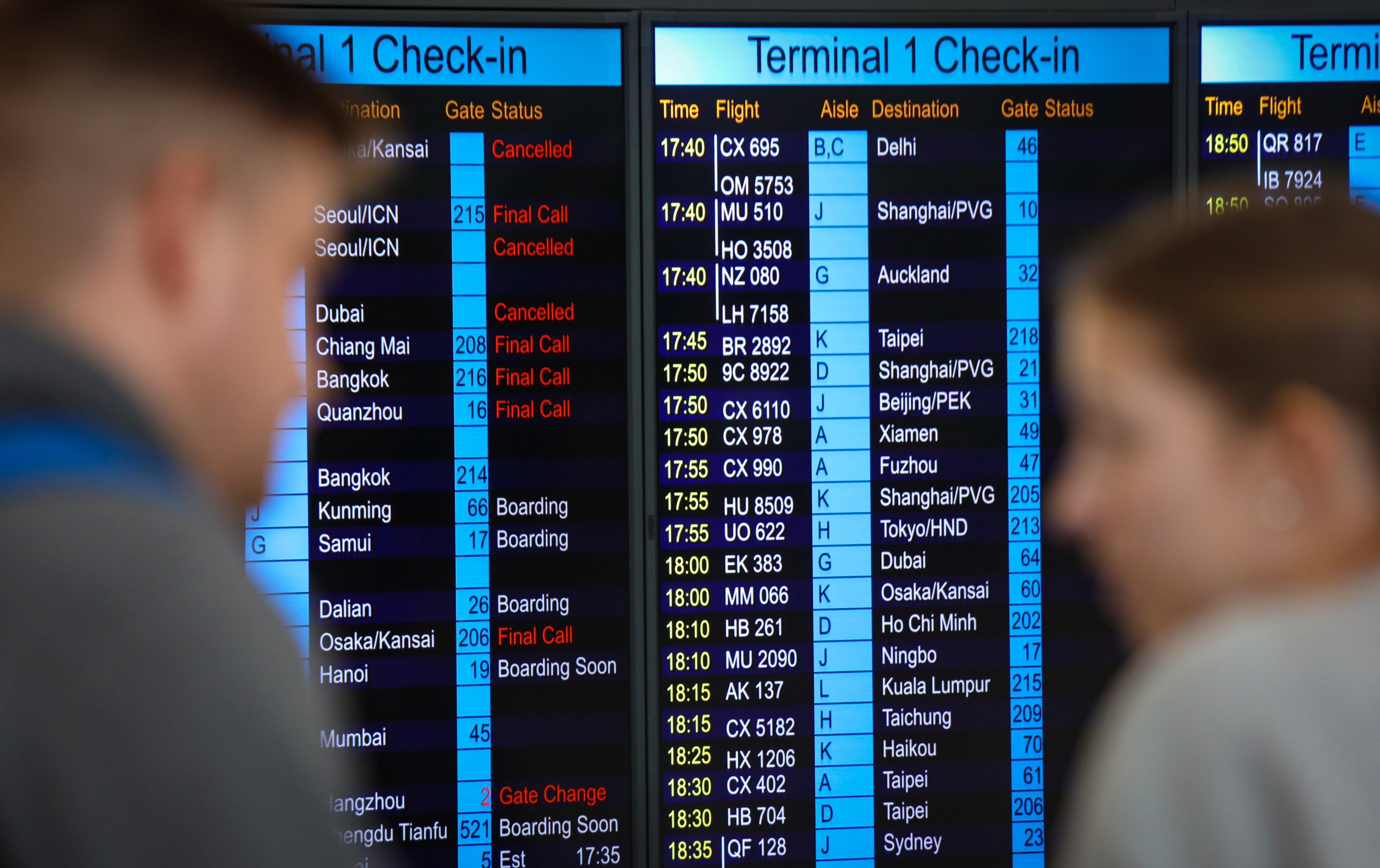 Passengers check flight information at Hong Kong International Airport, Chek Lap Kok. Cathay Pacific has promised better performance in the wake of a spate of flight cancellations. Photo: Xiaomei Chen