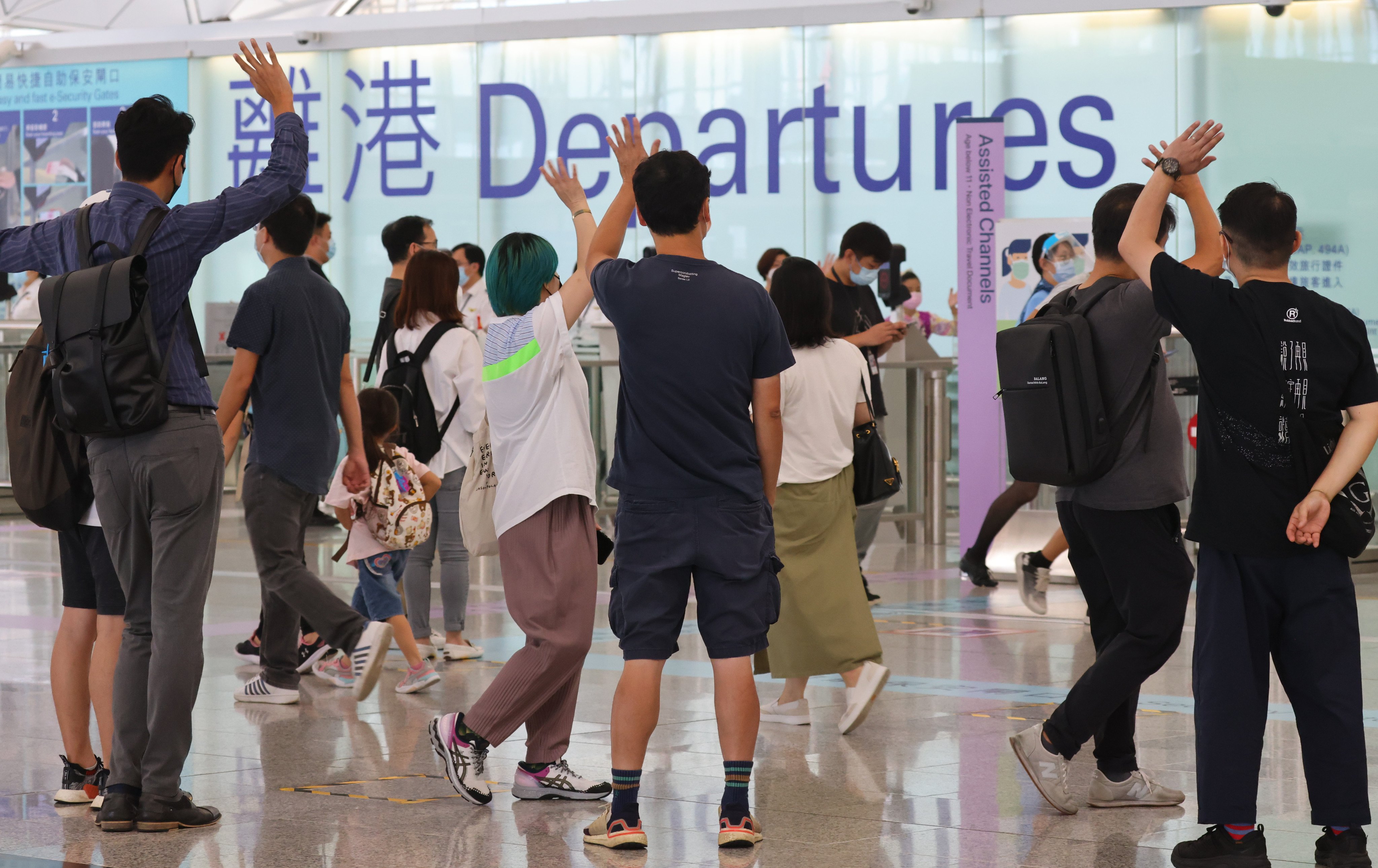 Family, relatives and friends bid farewell to their loved ones leaving the city in 2021.  Before the emigration wave,  less than 40 per cent of educators withdrew their retirement funds due to resignation. Photo: Dickson Lee