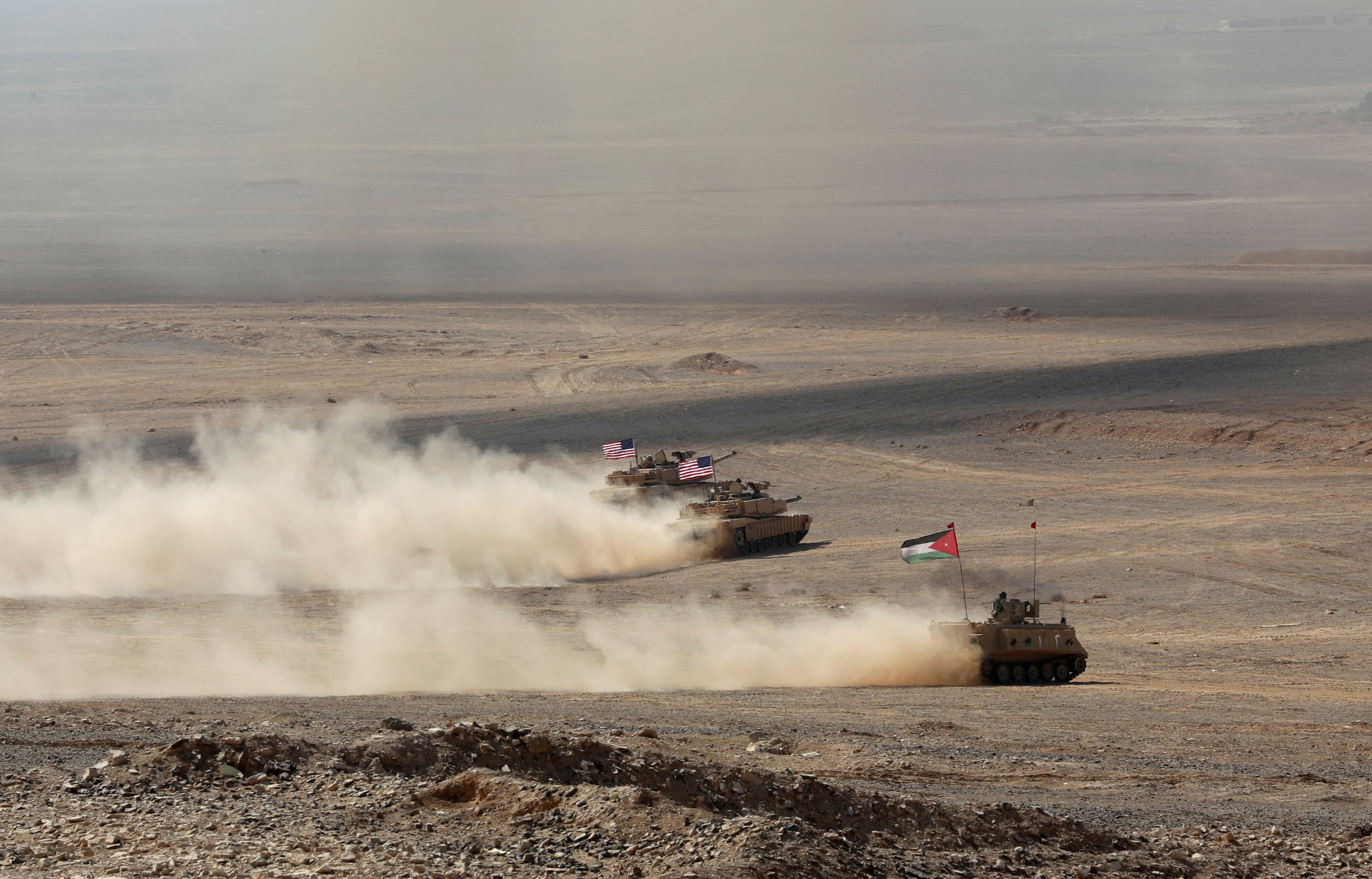 Armoured vehicles with Jordanian and US flags take part in a military exercise in Zarqa, Jordan in September 2022. Photo: Reuters