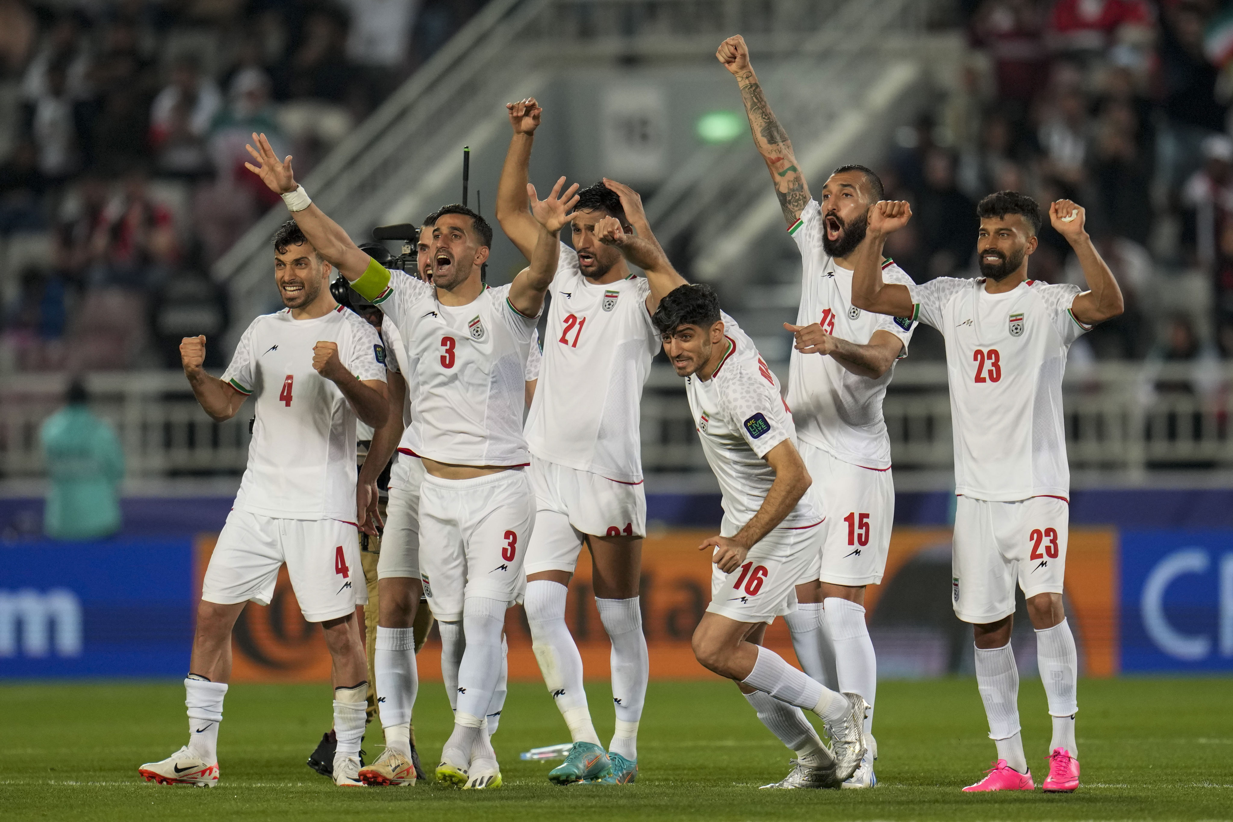 Iran players celebrate after beating Syria on penalties in the last 16 of the Asian Cup. Photo: AP