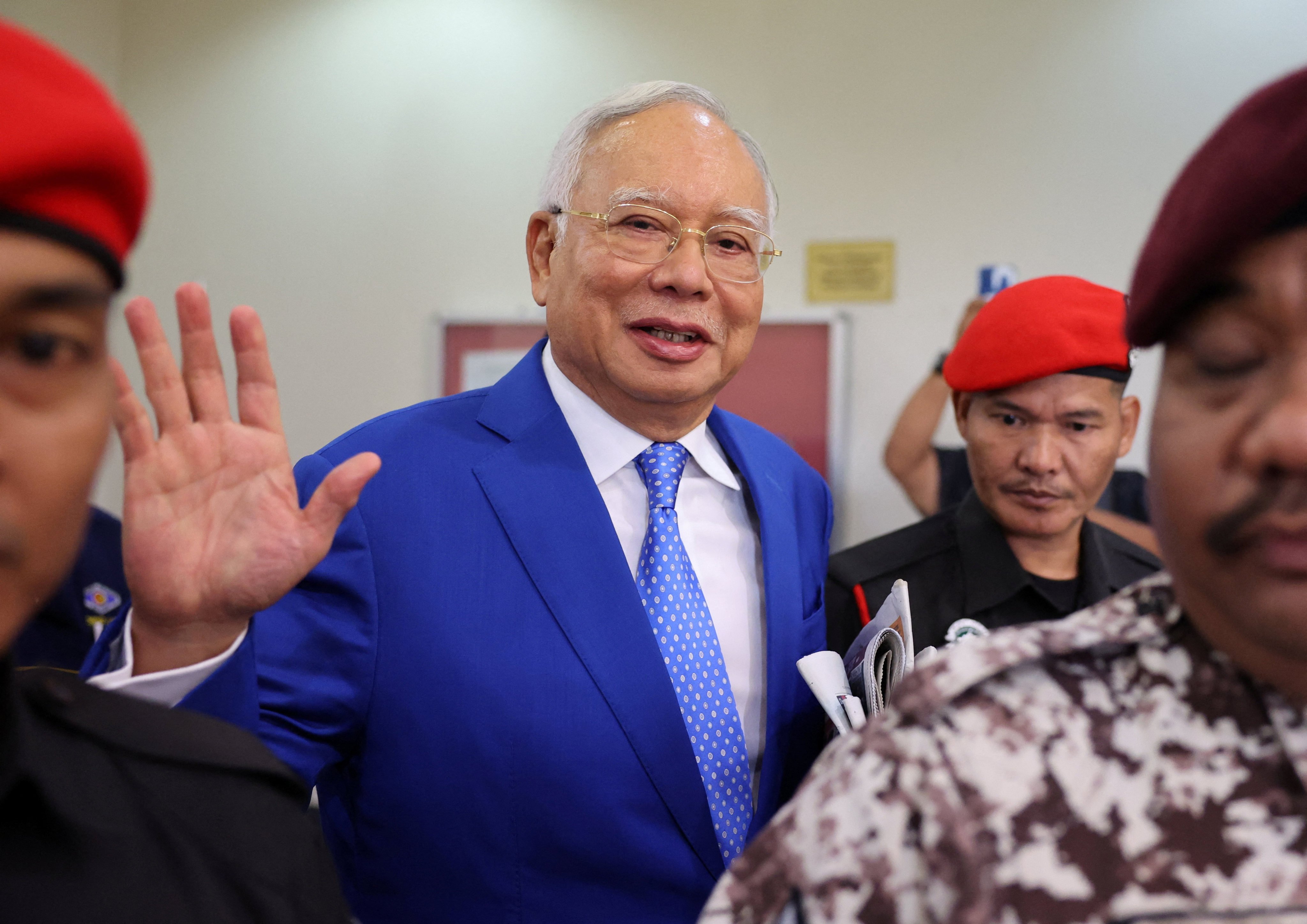 Former Malaysian Prime Minister Najib Razak waves as he leaves court in Kuala Lumpur last month. Photo: Reuters
