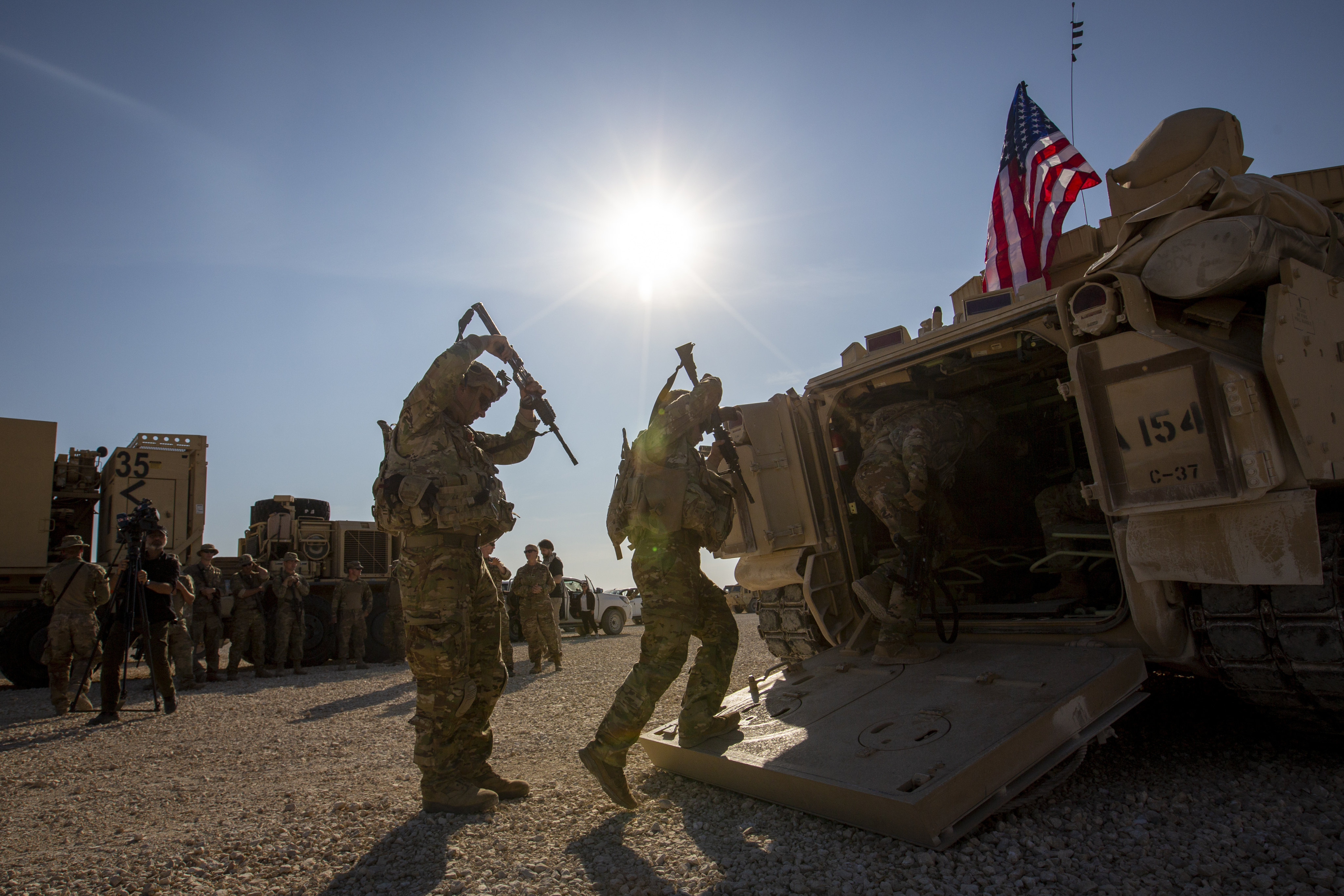 The crew enter a Bradley fighting vehicle at a US military base at an undisclosed location in northeastern Syria on November 11, 2019. Photo: AP 