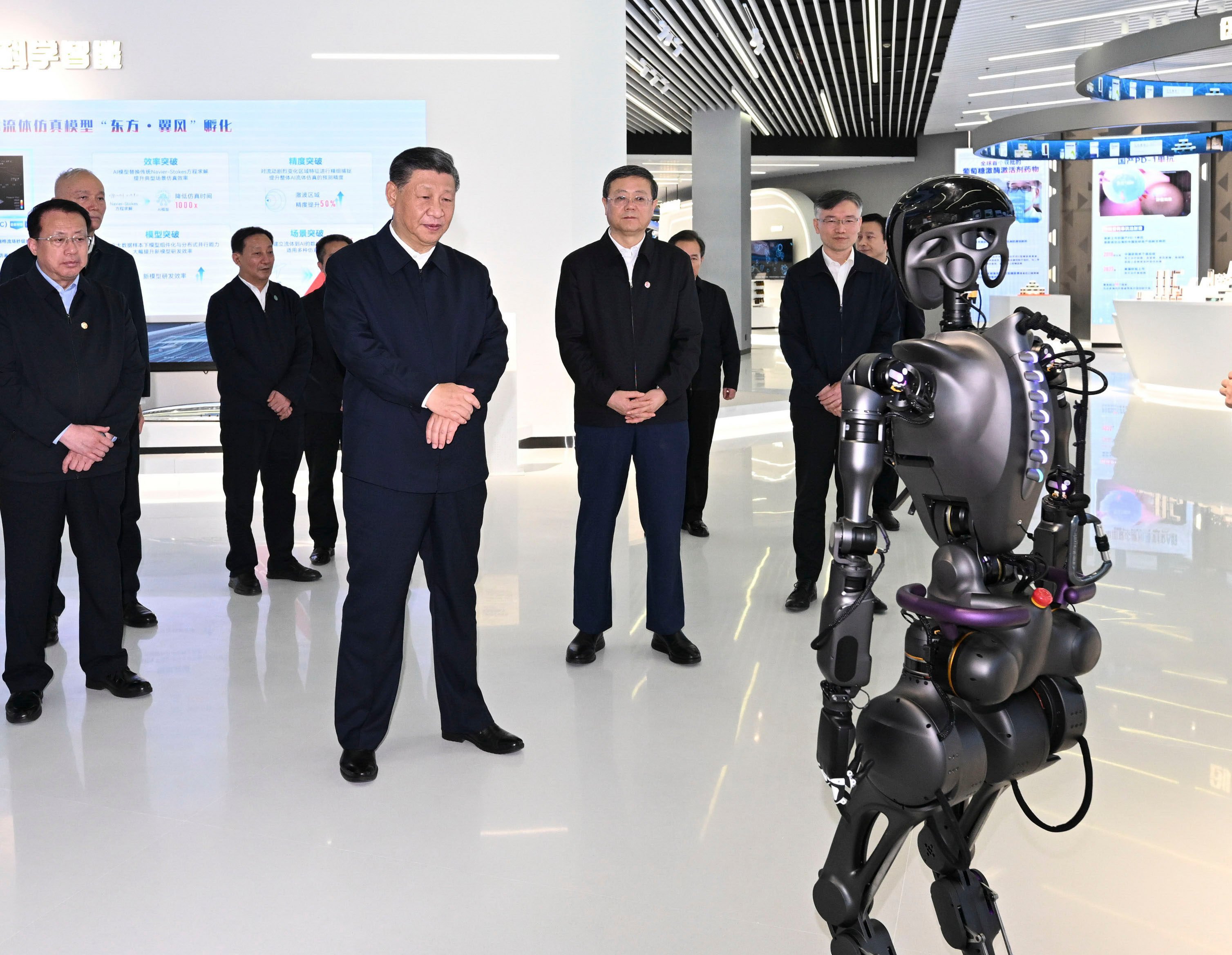 Chinese President Xi Jinping (left) inspects an exhibition on science and tech innovations in Shanghai on November 28. The Chinese leader said at a Politburo meeting on Wednesday that China must use innovation to cultivate new industries. Photo: Xinhua