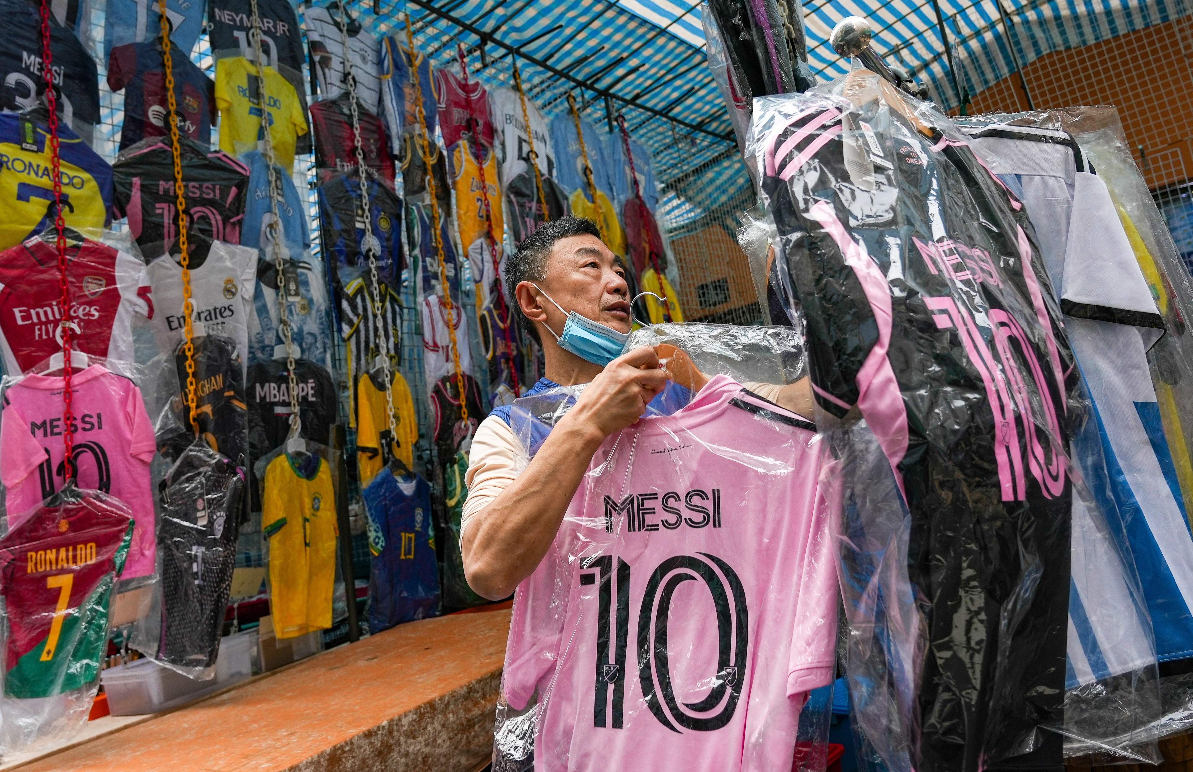 A store in Mong Kok sells Lionel Messi’s jerseys. Sportswear retailers in the city have seen customers flocking to their stores in search of the World Cup winner’s jerseys. Photo: Eugene Lee