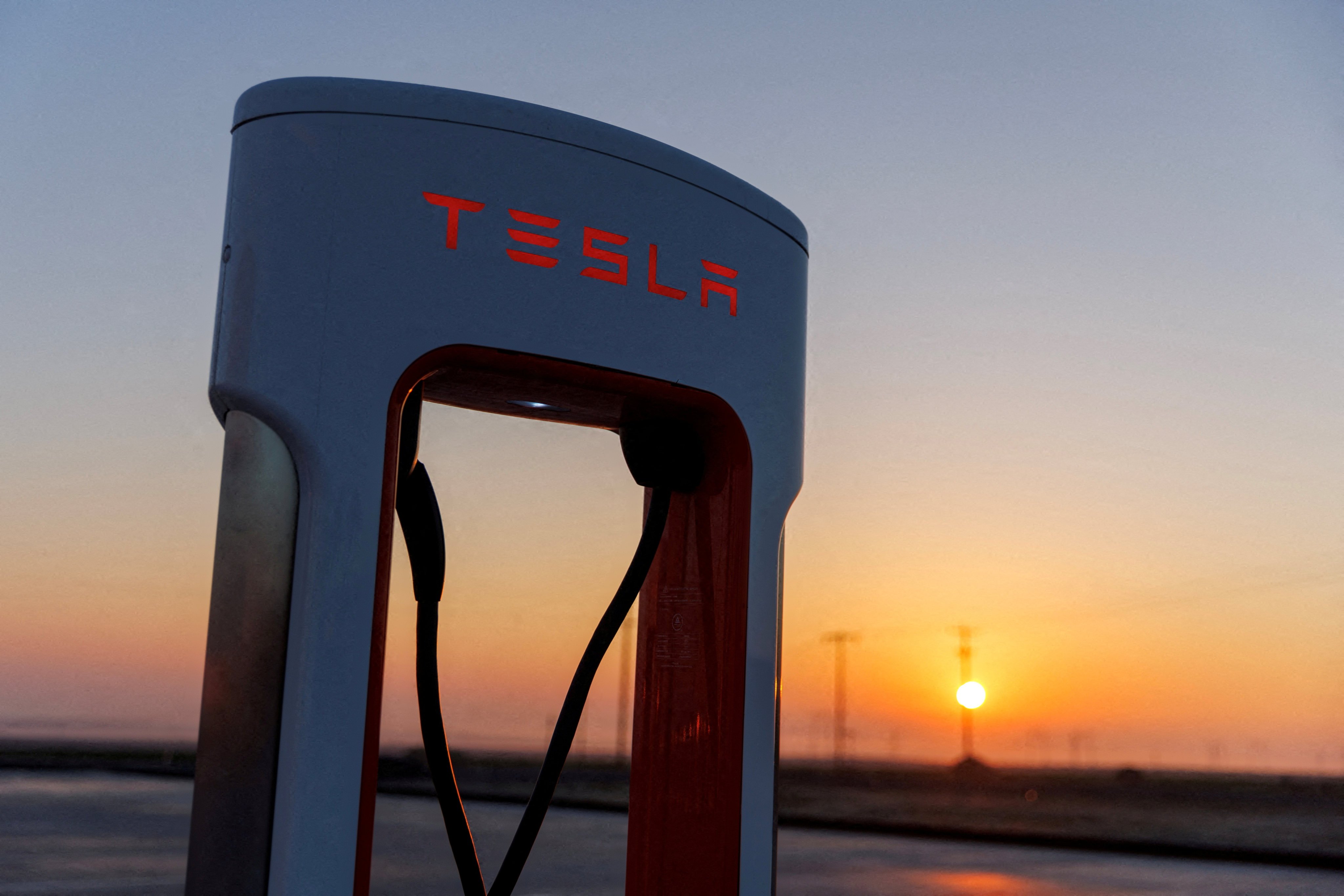 A Tesla supercharging station is seen in the early morning sun, in Kettleman City, California, on January 25, 2023.  Photo: Reuters