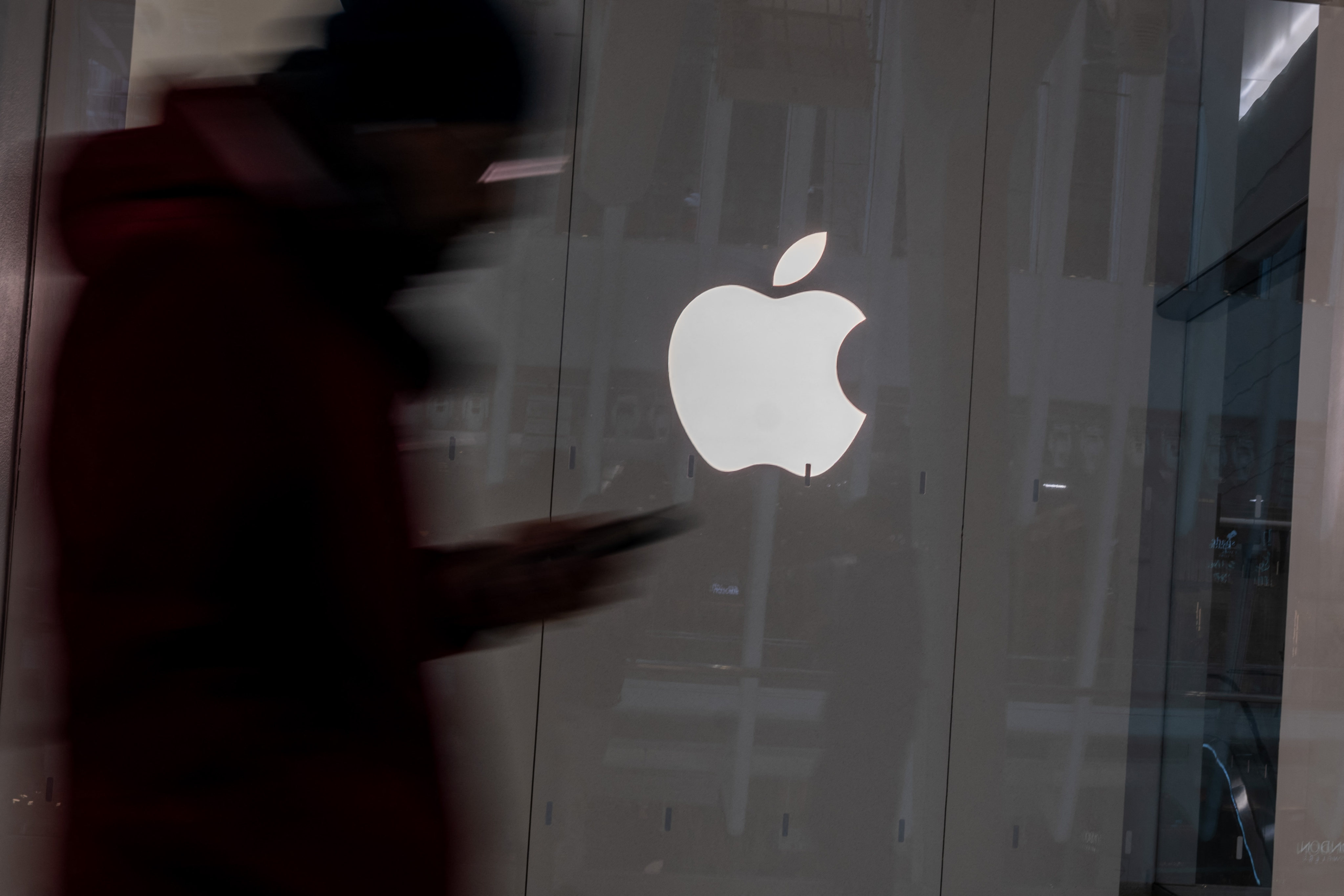 People walk by an Apple Store in a shopping mall in New York City on February 1, 2024. Photo: Getty Images via AFP