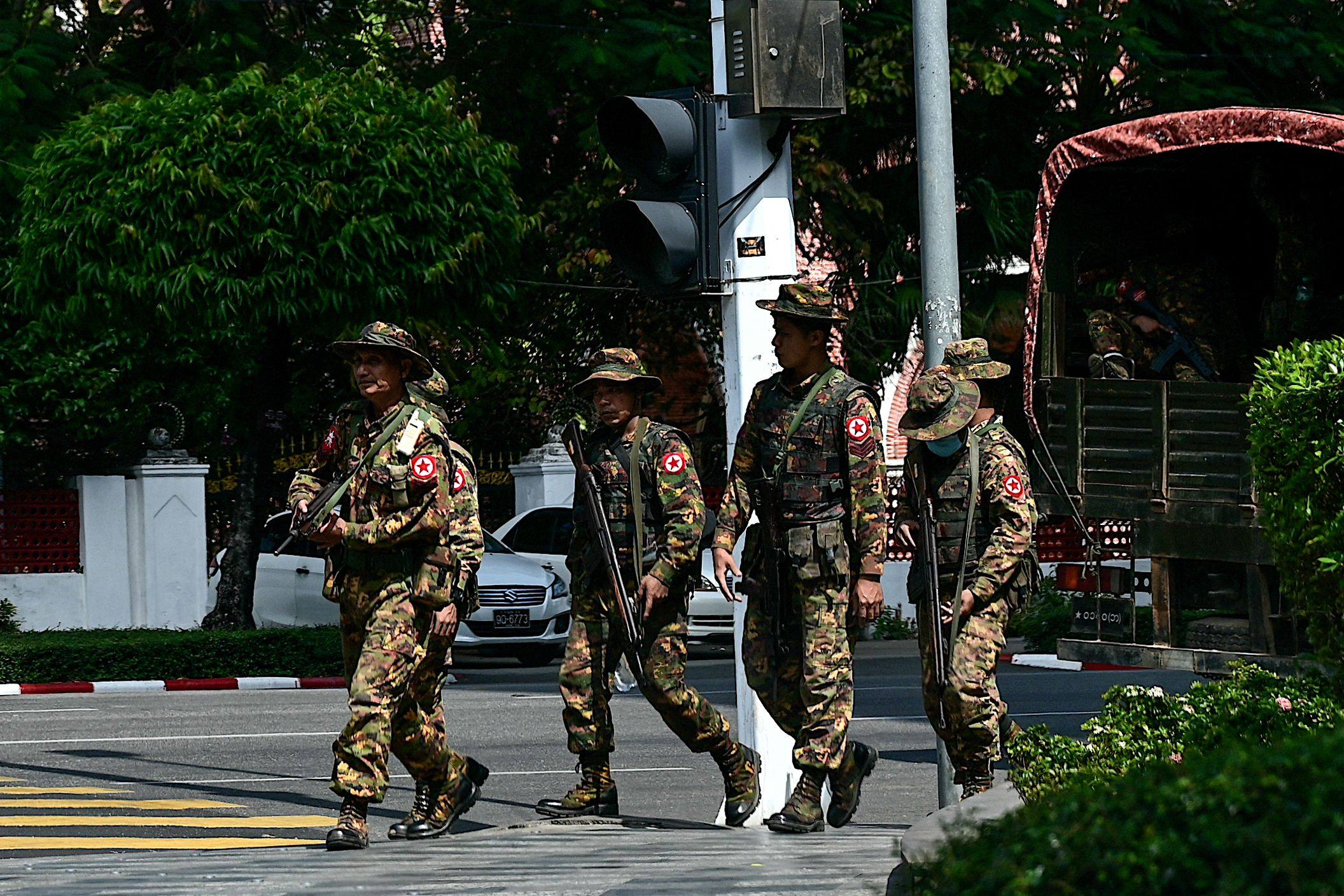 Myanmar’s security forces patrol a street during a “silent strike” to mark the third anniversary of the military coup in Yangon on February 1. Photo: AFP