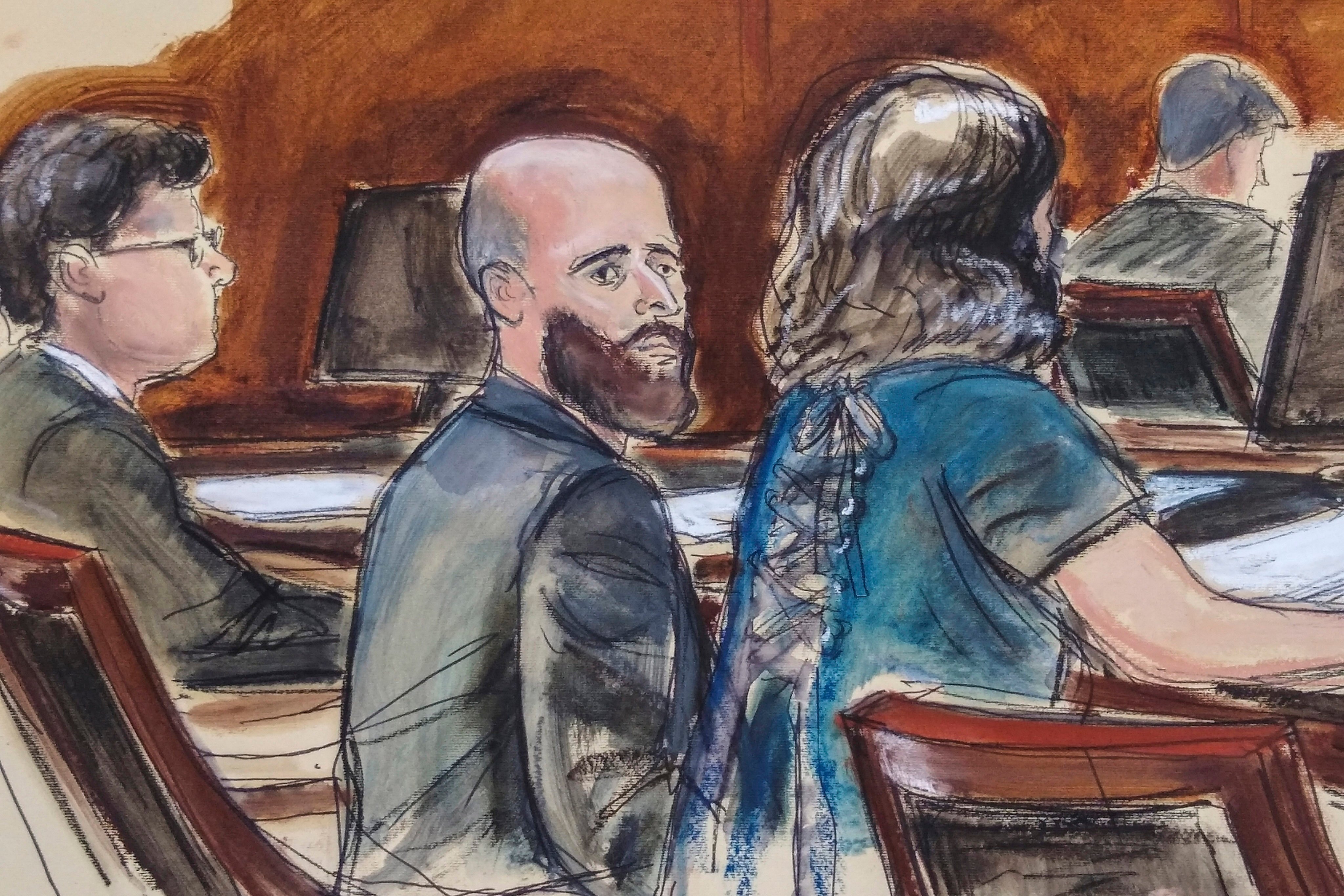 Joshua Schulte (centre) is flanked by his lawyers during jury deliberations in New York in March 2020. Courtroom sketch: Elizabeth Williams via AP