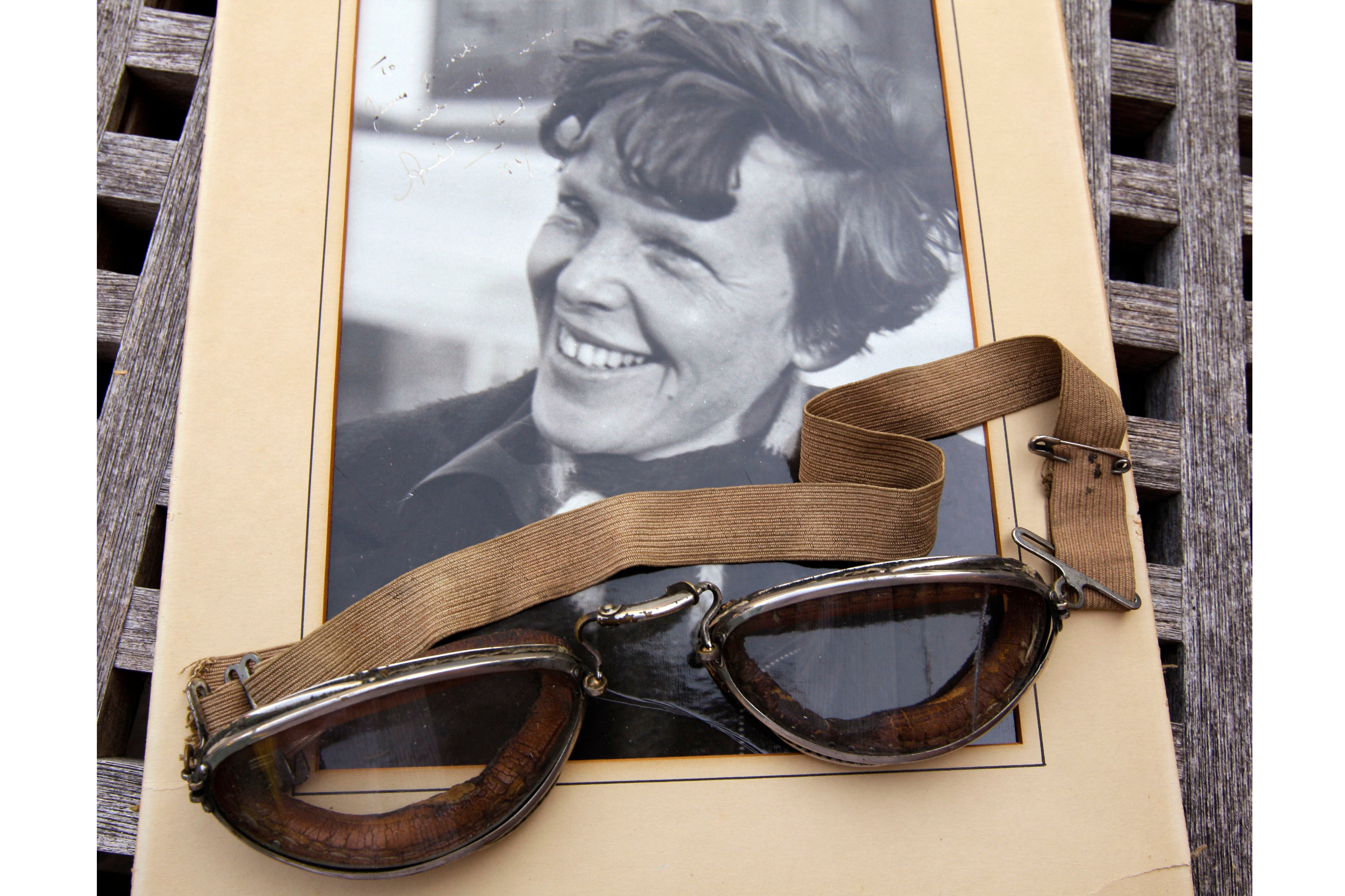 A photo of Amelia Earhart dated 1937, along with goggles she was wearing during her first plane crash. A fuzzy sonar image has ignited hopes of finding her missing plane almost nine decades after it disappeared. Photo: AP/File