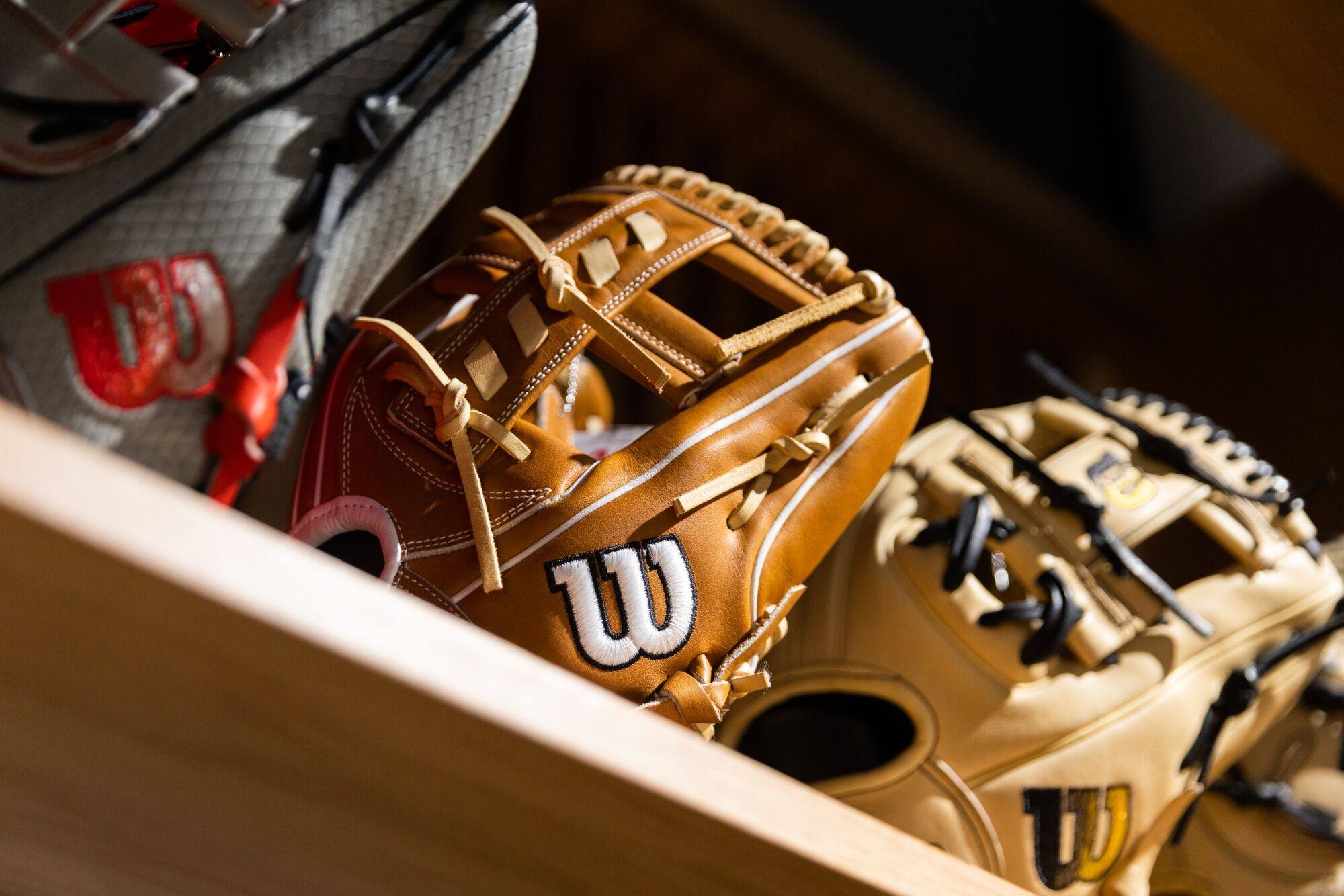 Wilson baseball gloves at the company’s flagship store in the SoHo neighborhood of New York, US, on Thursday, Jan. 4, 2024. Amer Sports Inc., the company behind sporting goods brands Wilson, Salomon and Arc’teryx, has filed for a US initial public offering. Photo: Bloomberg
