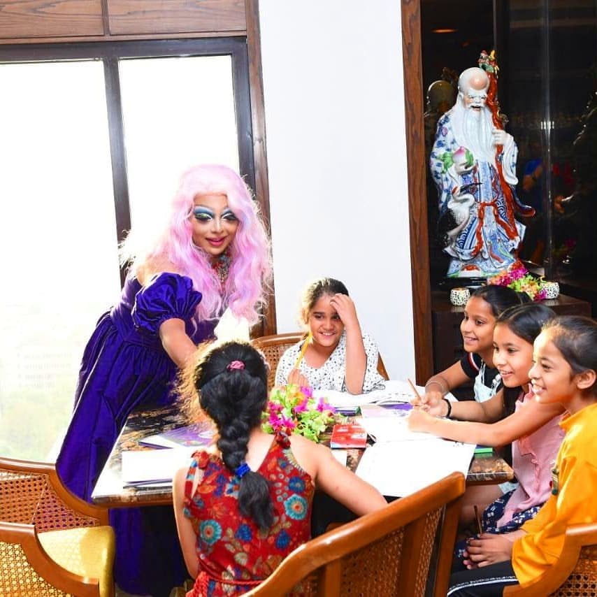 Delhi-based drag artist Lush Monsoon with students at a school. Photo: Instagram/lushmonsoon