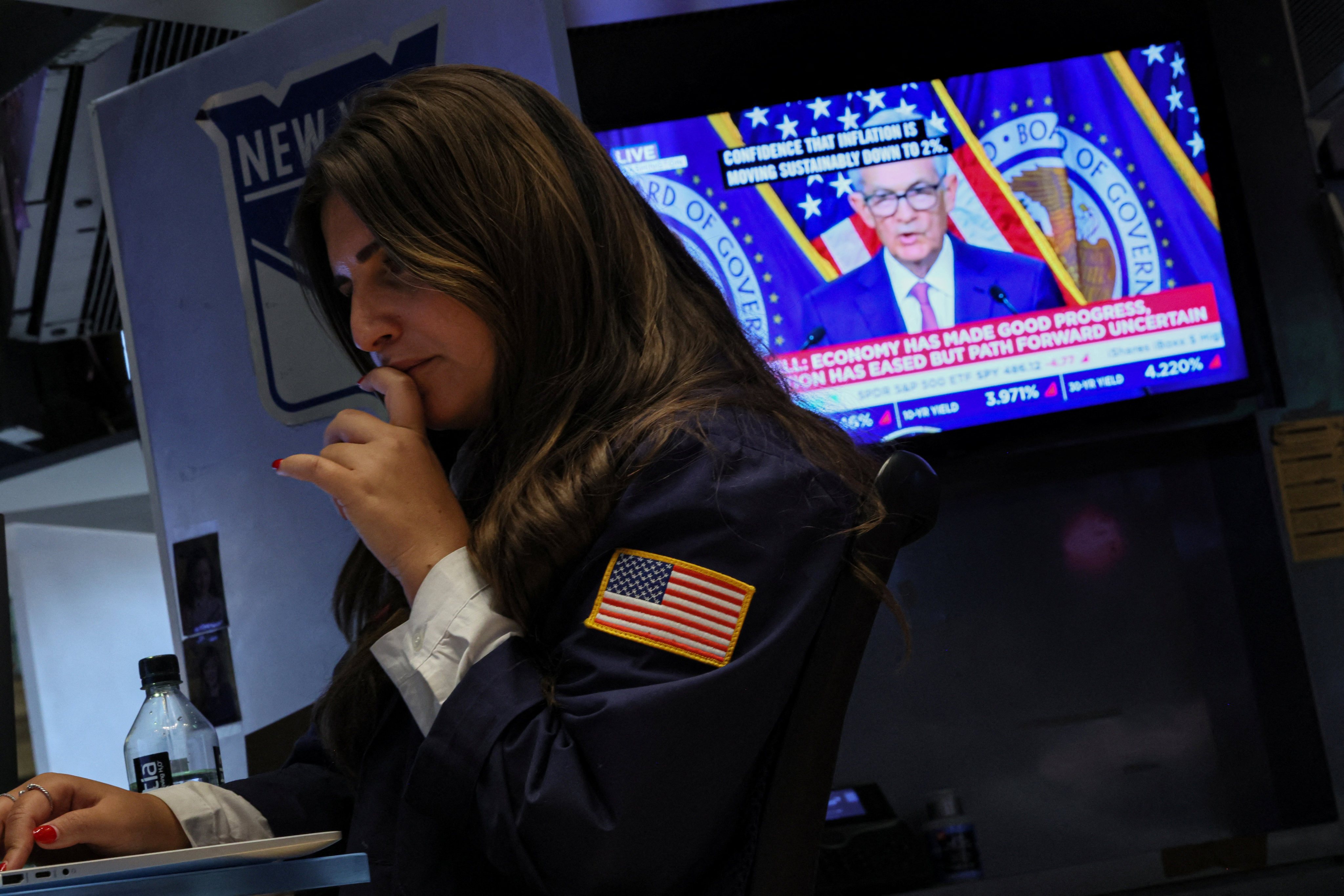 A trader works, as a screen displays a news conference by Federal Reserve Board Chairman Jerome Powell following the Fed rate announcement in January, on the floor of the New York Stock Exchange. Photo: Reuters