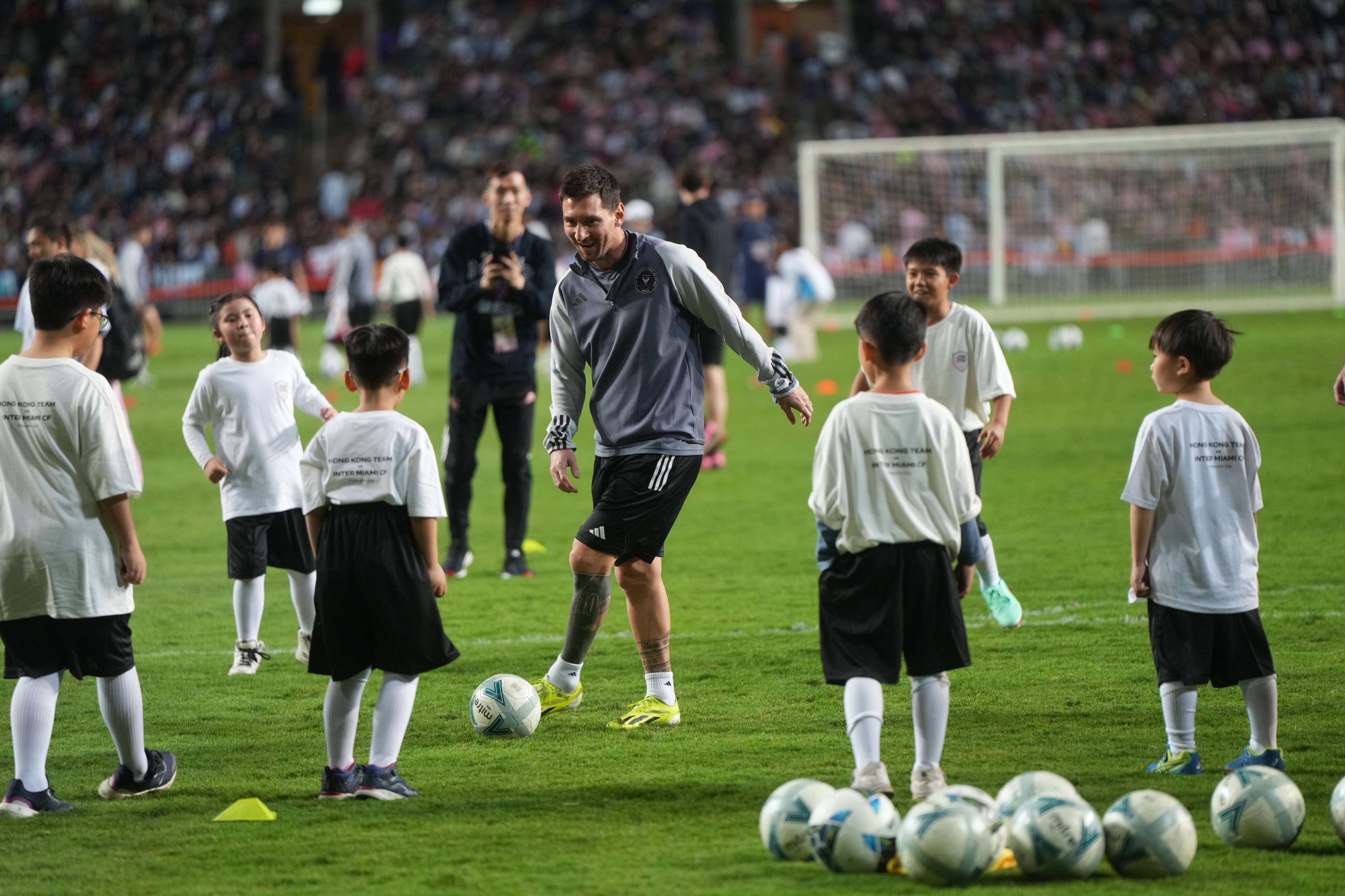 Lionel Messi takes part in a coaching clinic with some local children at Hong Kong Stadium. Photo: Sam Tsang