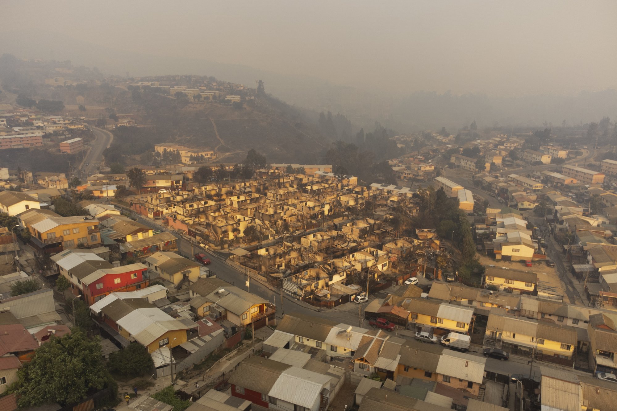 An aerial image shows homes affected by the forest fires in El Olivar, Vina del Mar. Photo: EPA-EFE