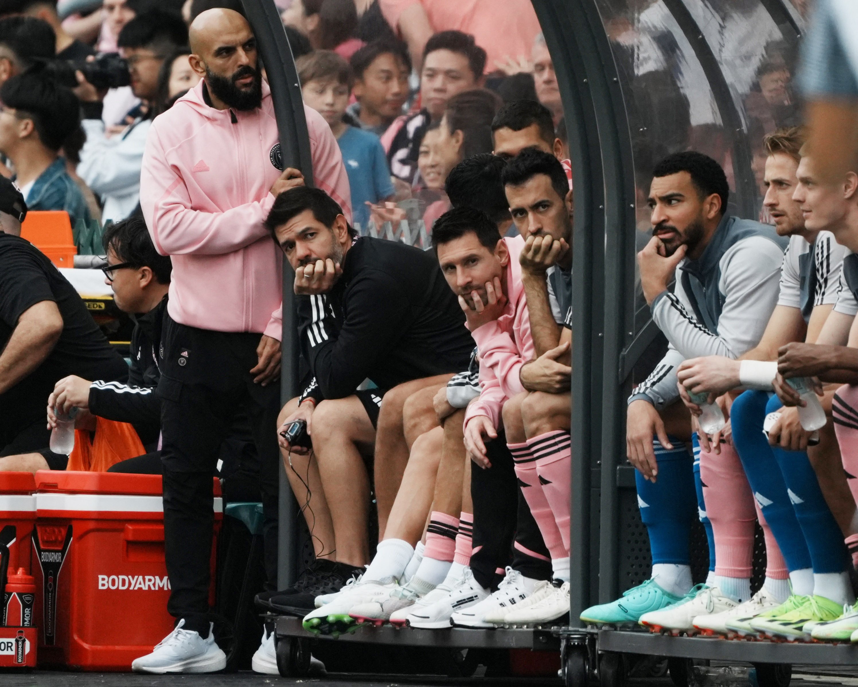 Lionel Messi (second from left), Sergio Busquets (third from left) and their fellow Inter Miami substitutes watch the match in Hong Kong. Photo: Reuters