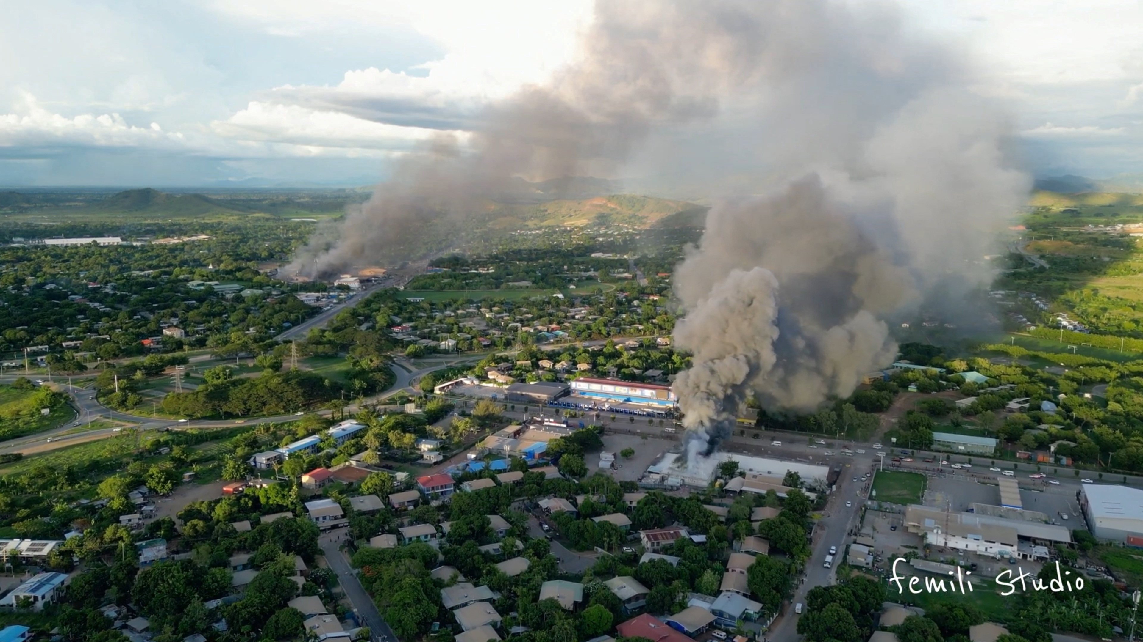 An aerial view of smoke billowing from burning buildings in Port Moresby, Papua New Guinea, last month amid looting and arson during widespread protests and riots. Photo: Femli Studio via Reuters