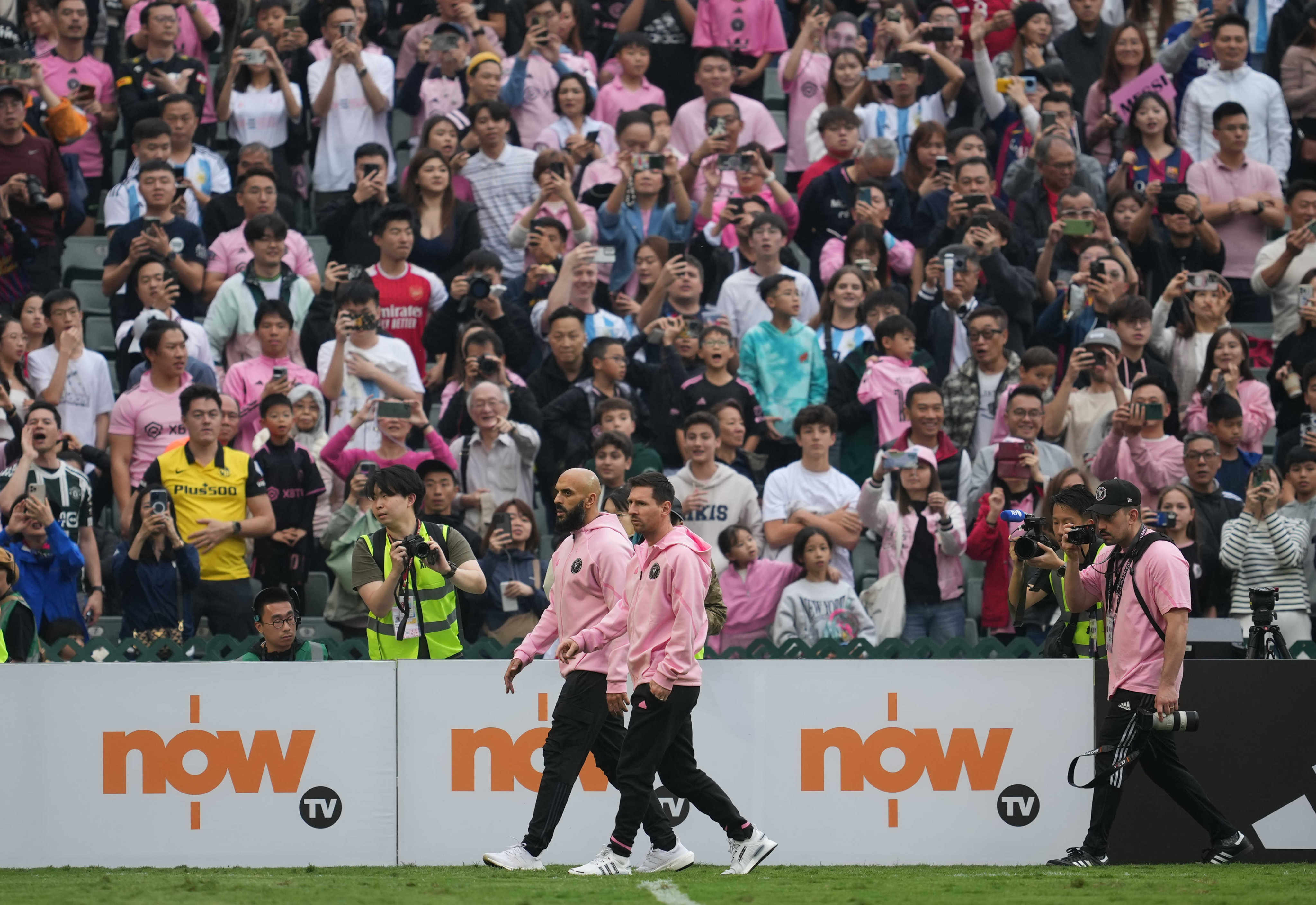 Inter Miami’s Lionel Messi (centre, right) walks the touchline with team mate Gonzalo Higuain during Sunday’s match with a Hong Kong select. Photo: Sam Tsang