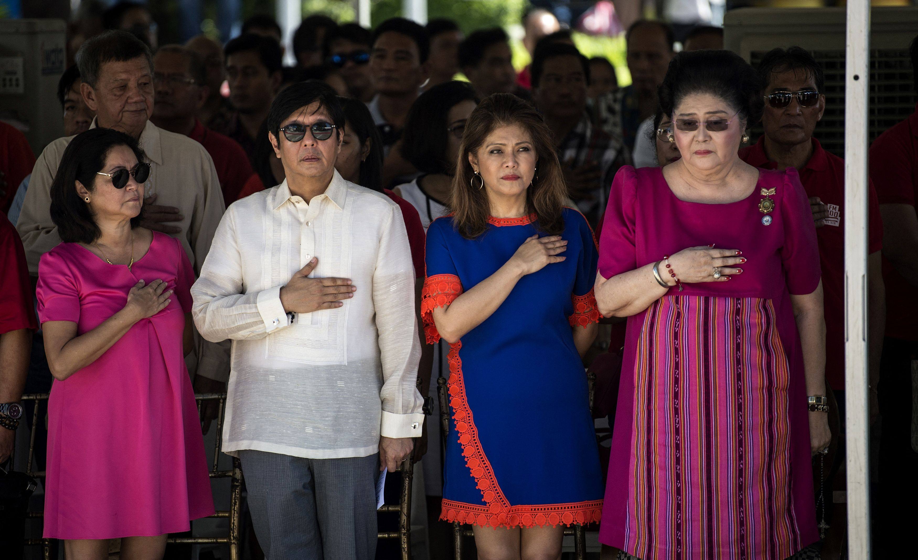 (From left) Louise “Liza” Araneta-Marcos, wife of President Ferdinand Marcos Jnr, President Marcos Jnr, his sister Imee and their mother, former Philippine first lady Imelda Marcos attend a wreath-laying ceremony at a monument to late dictator Marcos Snr. Photo: AFP