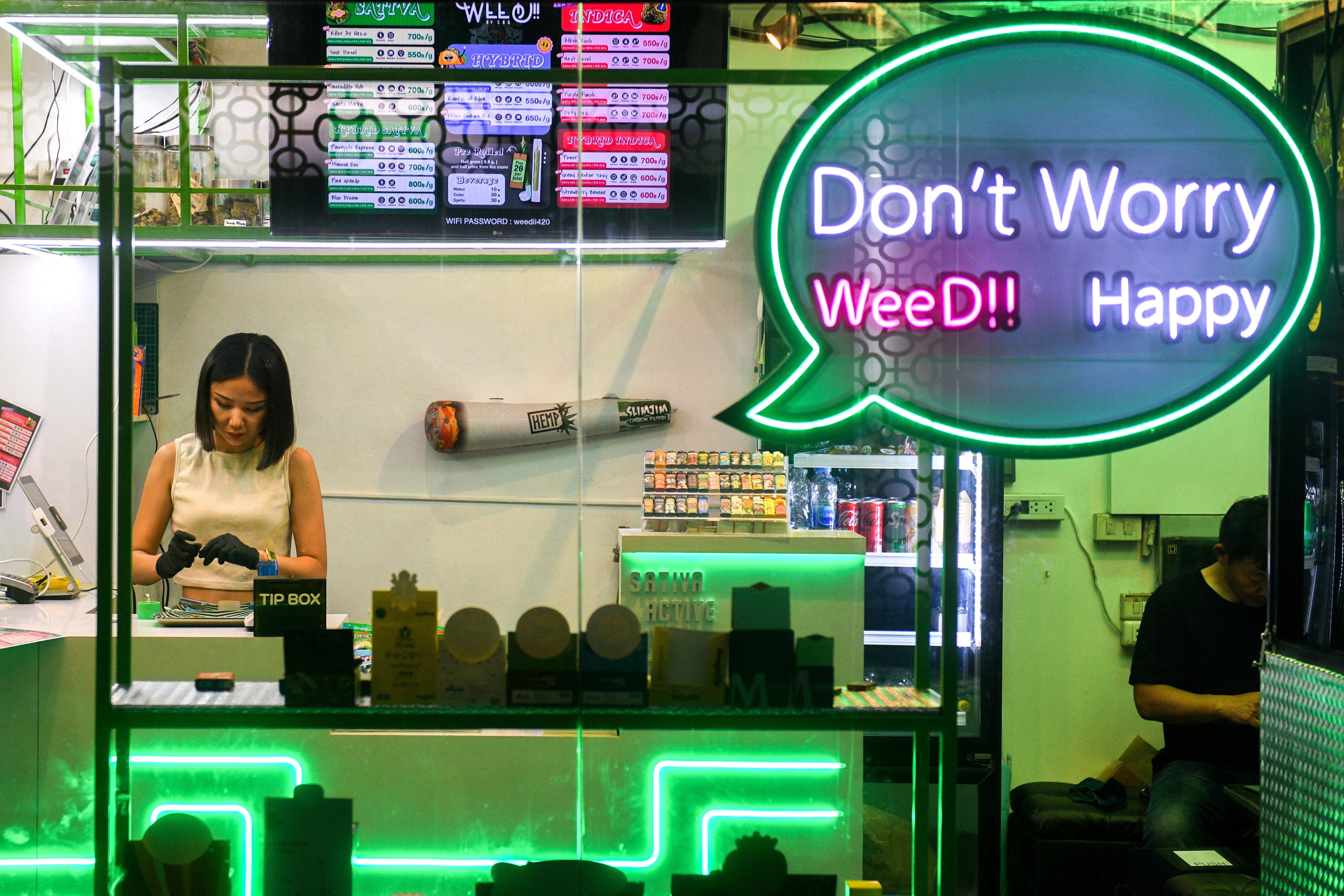 A worker at a cannabis shop in Bangkok. Photo: Reuters