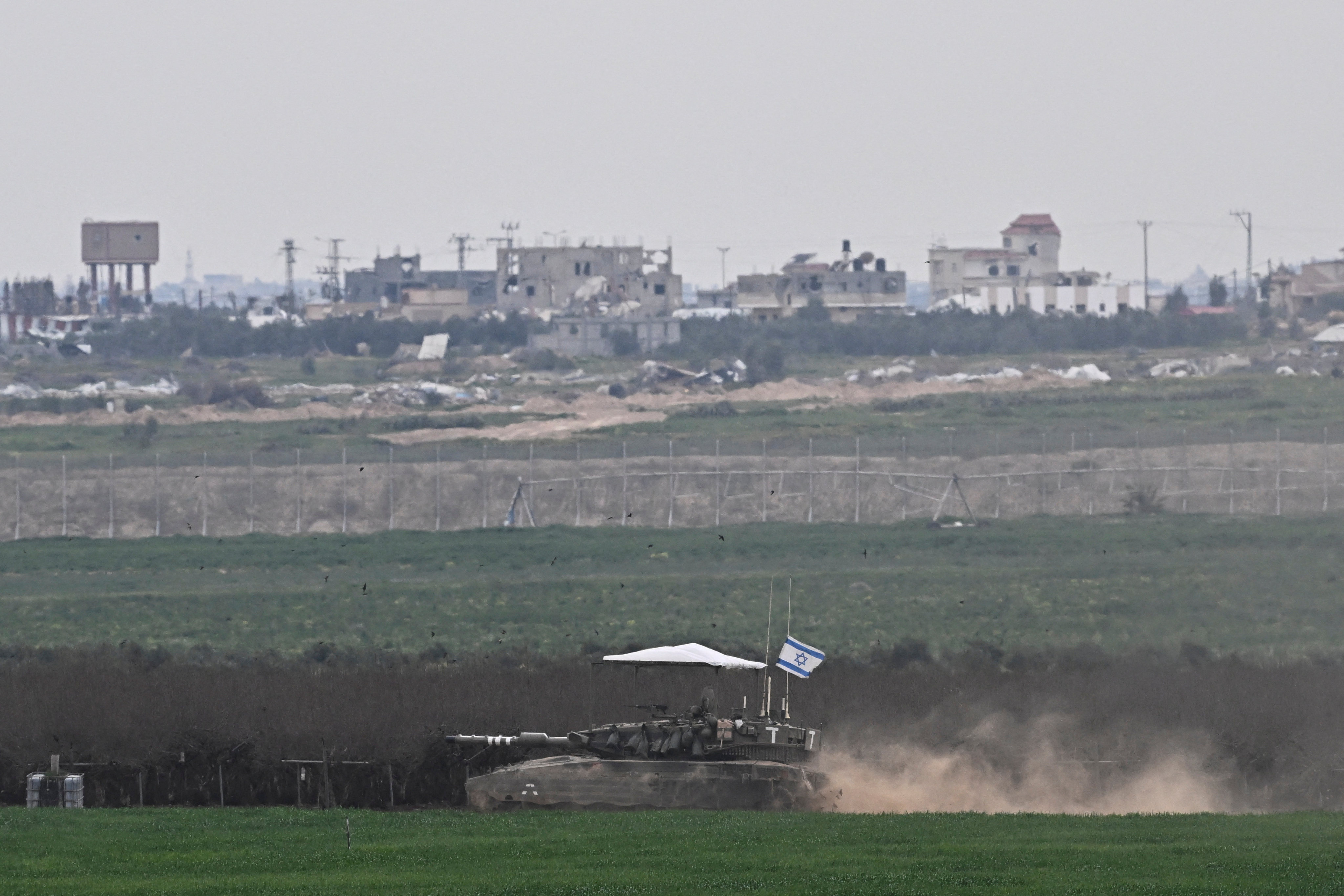 An Israeli tank maneuvers along the central Gaza Strip border. Photo: Reuters