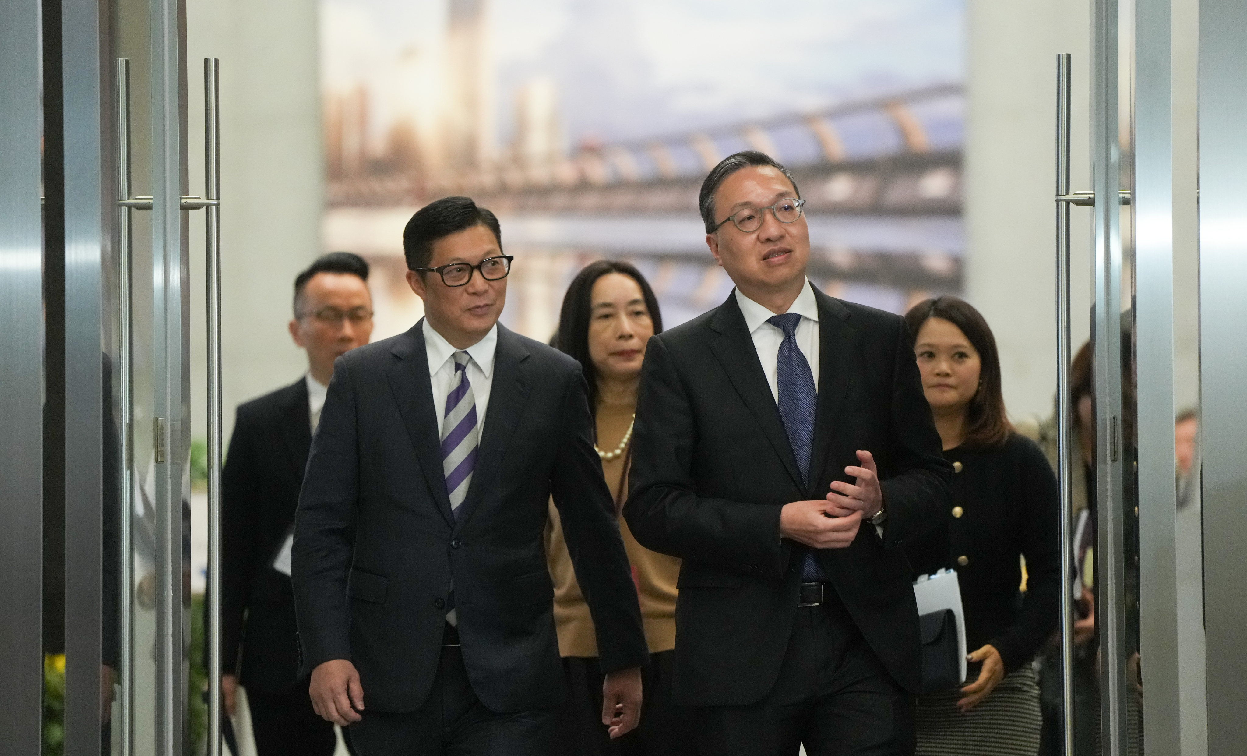 (From left) Secretary for Security Chris Tang and Secretary for Justice Paul Lam meet the media about Article 23 at Tamar on Tuesday. Photo: Sam Tsang