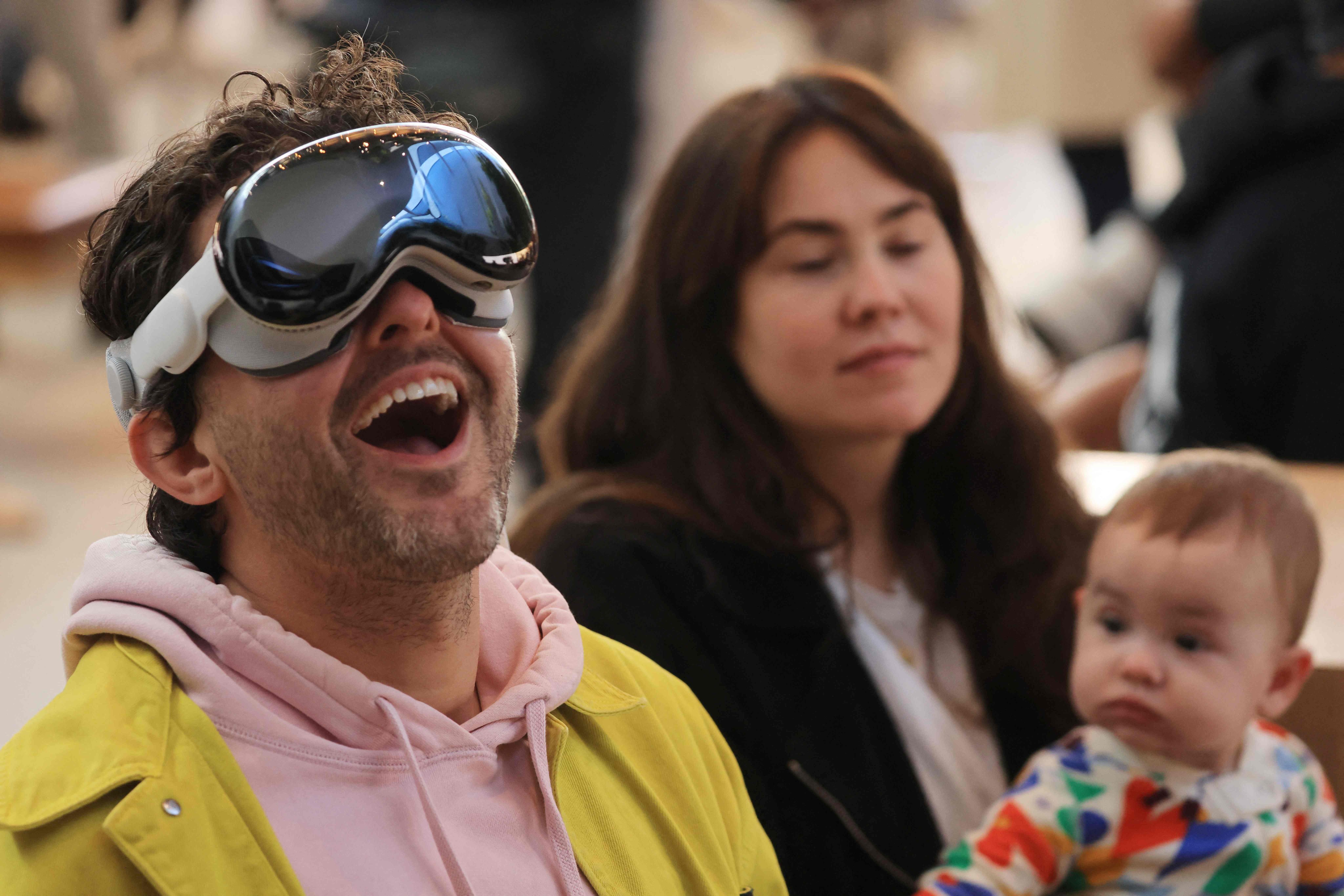 A customer tries on a Vision Pro at an Apple Store in Los Angeles, California. Photo: AFP