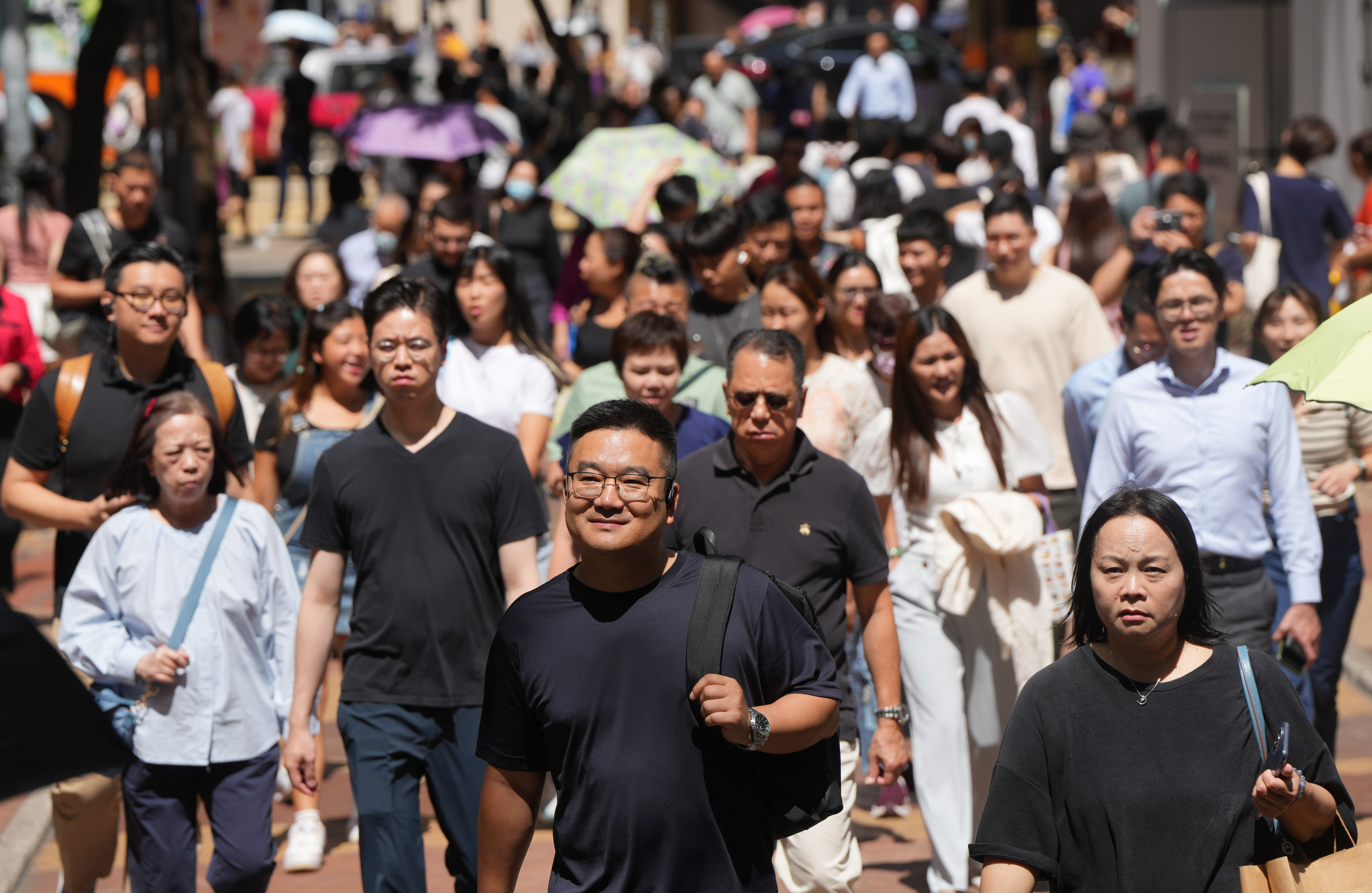 People walk in Causeway Bay, Hong Kong, during lunch time on September 28, 2023. Photo: Sam Tsang