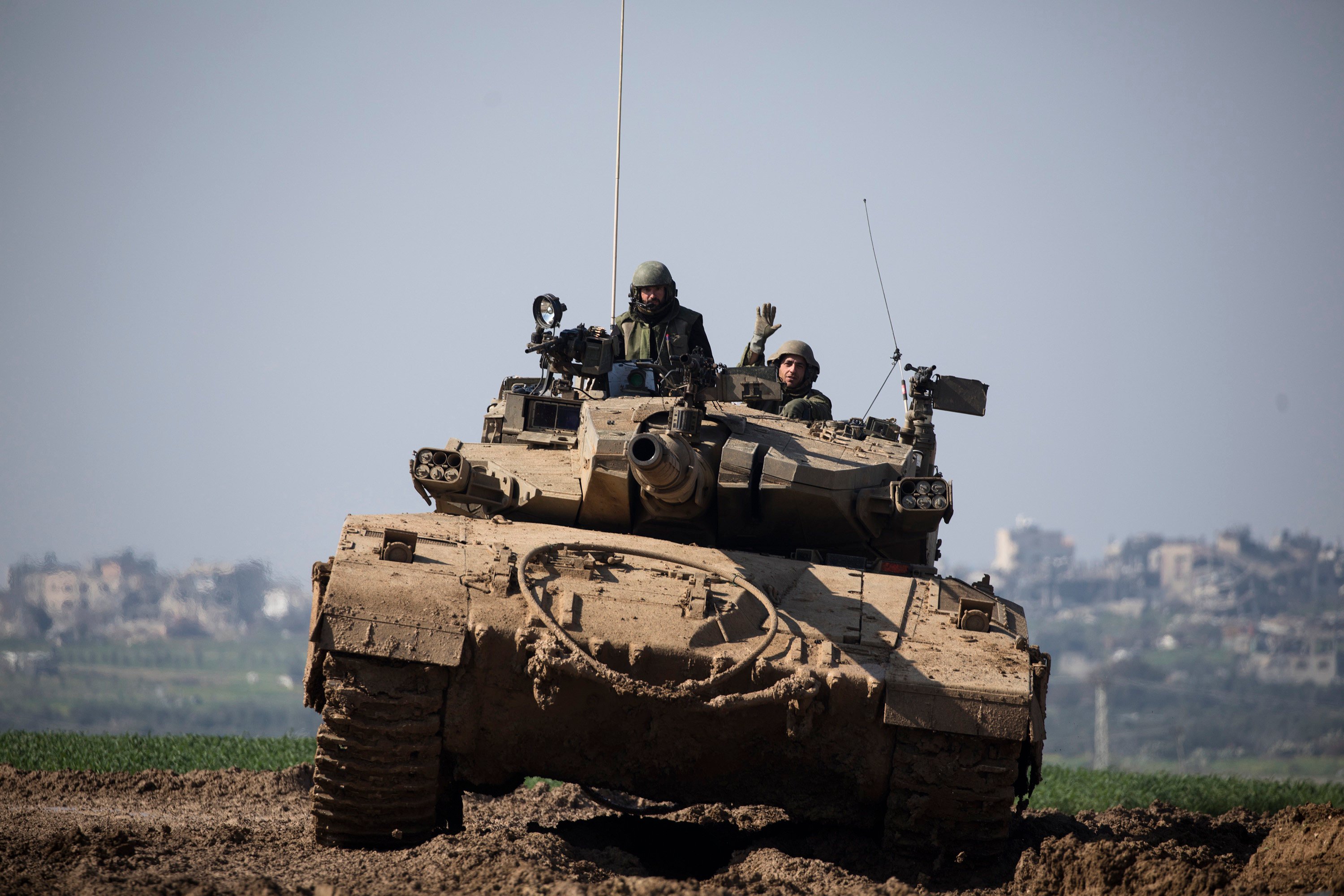 An Israeli tank moves along the border with Gaza in southern Israel on Tuesday. Photo: TNS