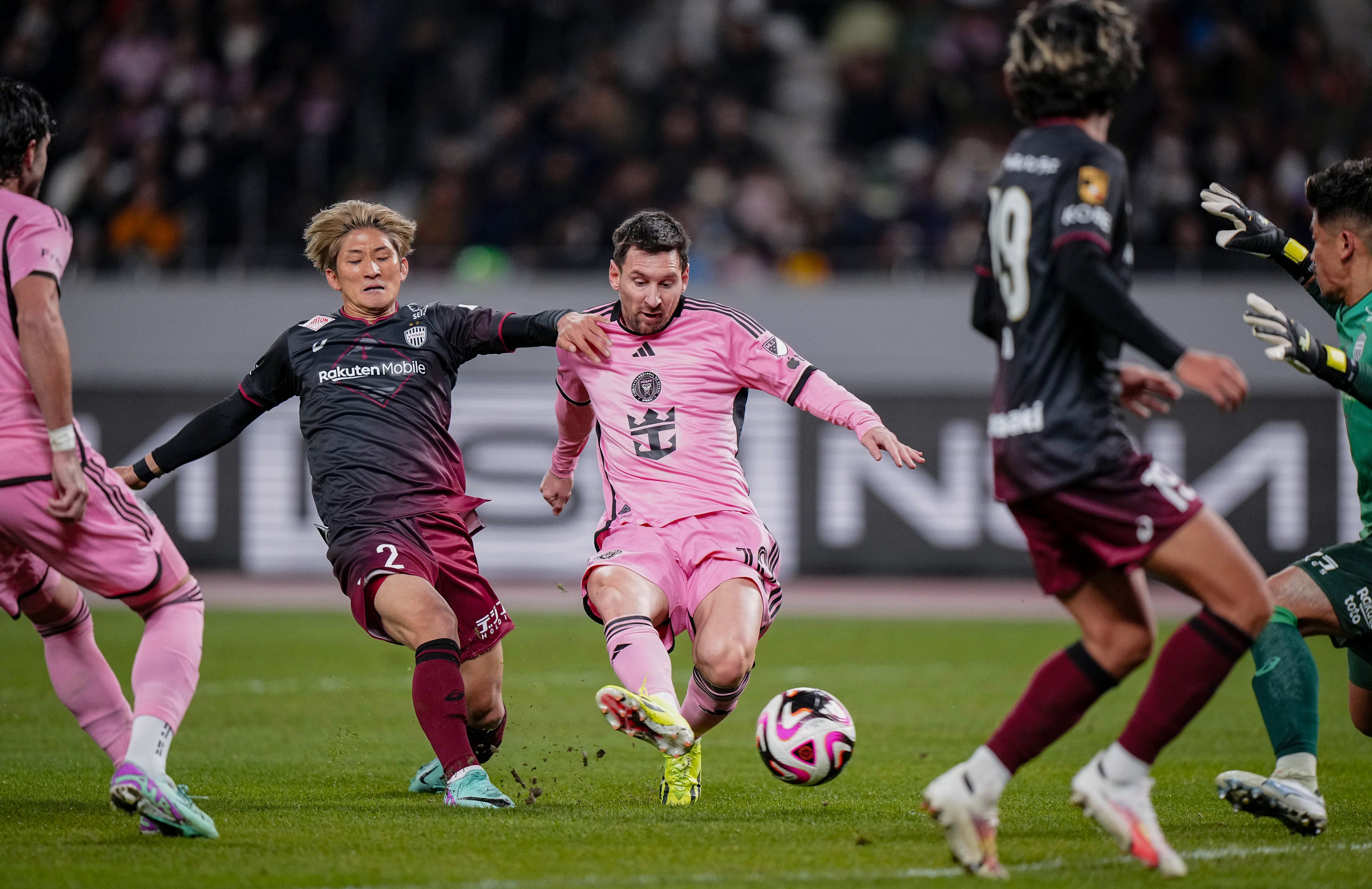 Inter Miami’s Lionel Messi (center) takes a shot against Vissel Kobe.   Messi played in Japan but remained on the bench for the whole game in Hong Kong. Photo: Kyodo