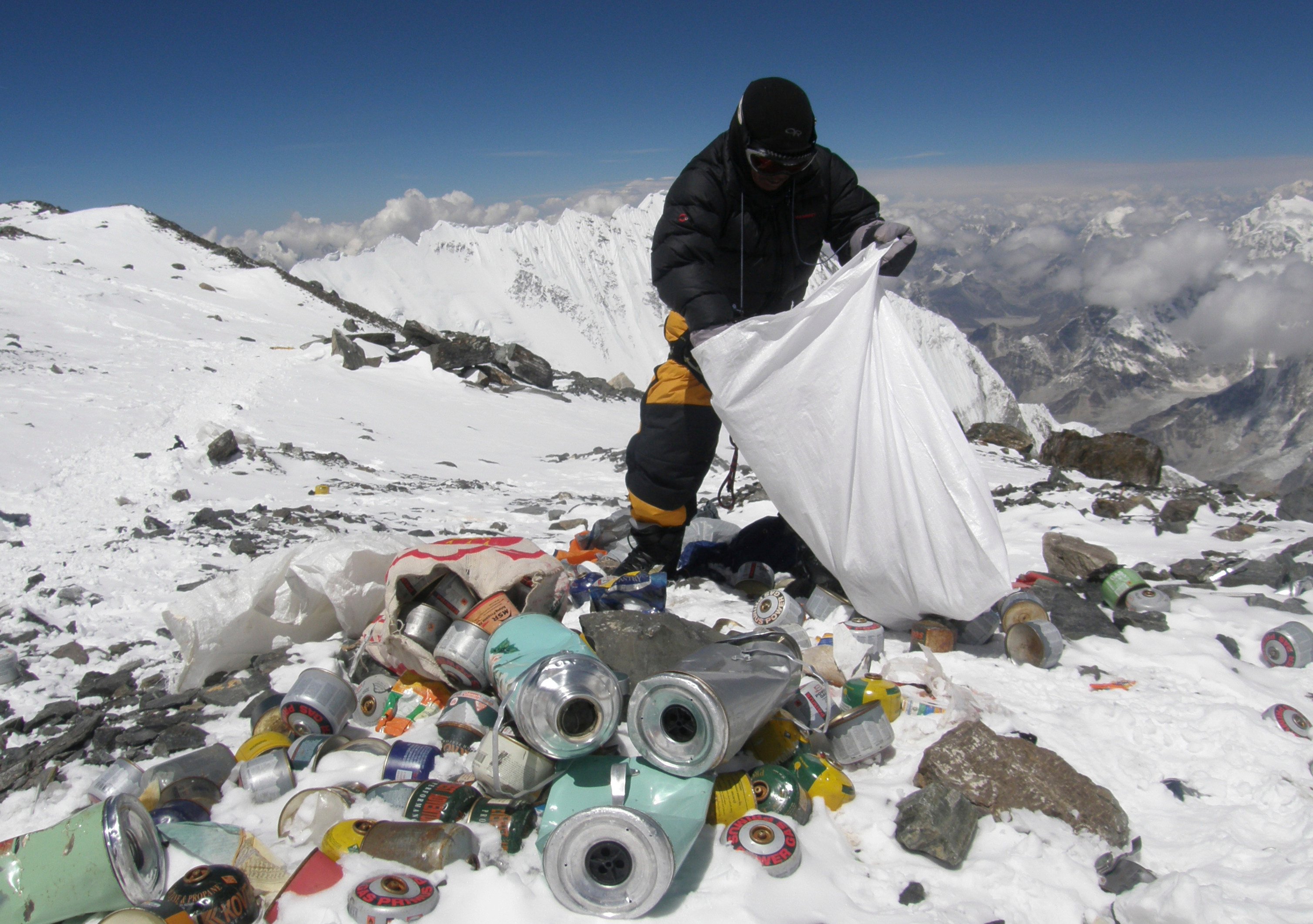 A Nepalese sherpa collecting garbage, left by climbers, at an altitude of 8,000 metres during the Everest clean-up expedition at Mount Everest. Photo: AFP