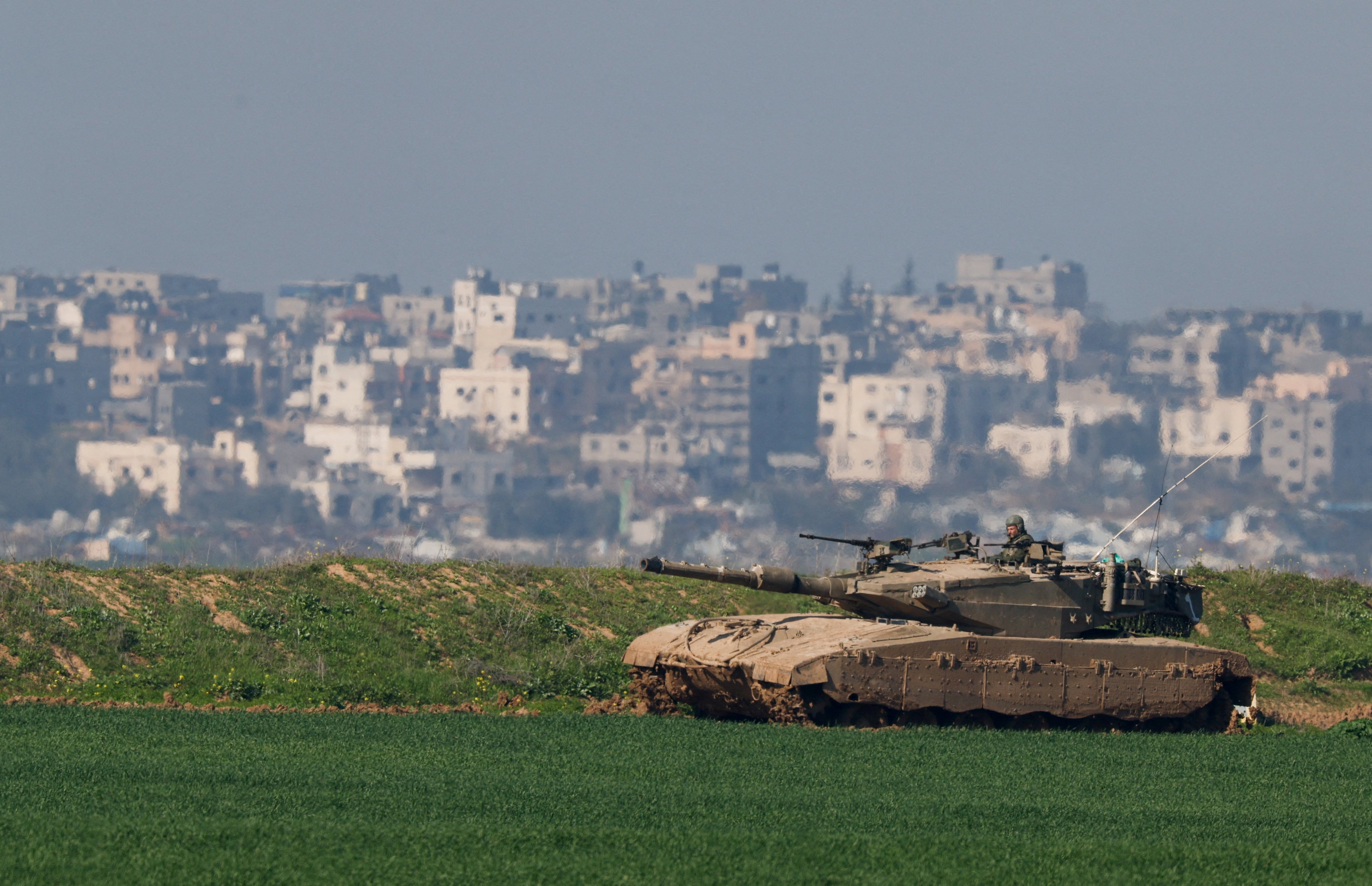 An Israeli tank manoeuvres along the northern Gaza Strip border, as seen from Israel. Photo: Reuters