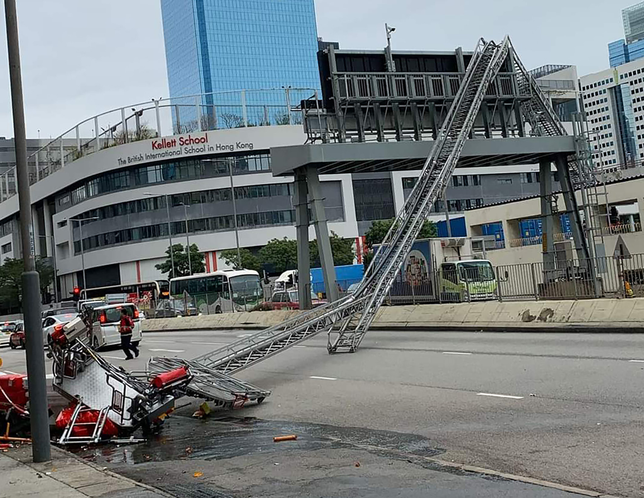 A 56-metre (184-foot) fire truck ladder collapsed on Friday blocking three lanes of Kai Cheung Road in Kowloon Bay on Friday. Photo: Handout