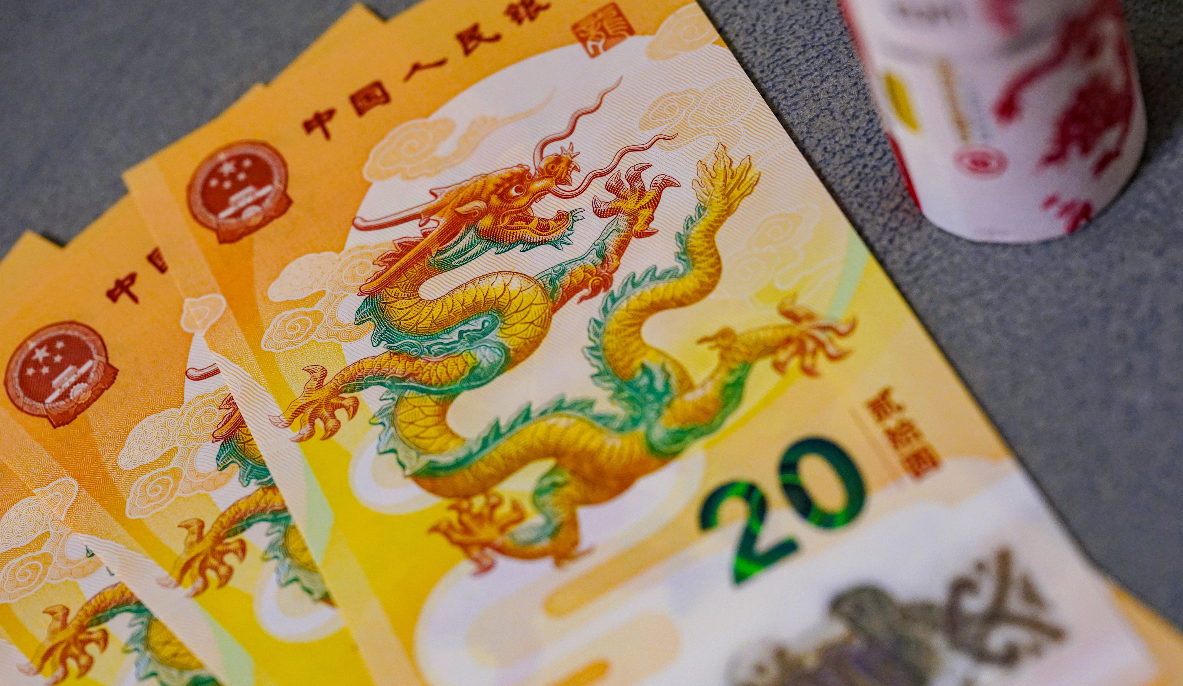 The People’s Bank of China unveiled a set of special gold, silver and copper alloy coins in December, alongside a 20-yuan banknote, to usher in the year of the dragon. Photo: Weibo