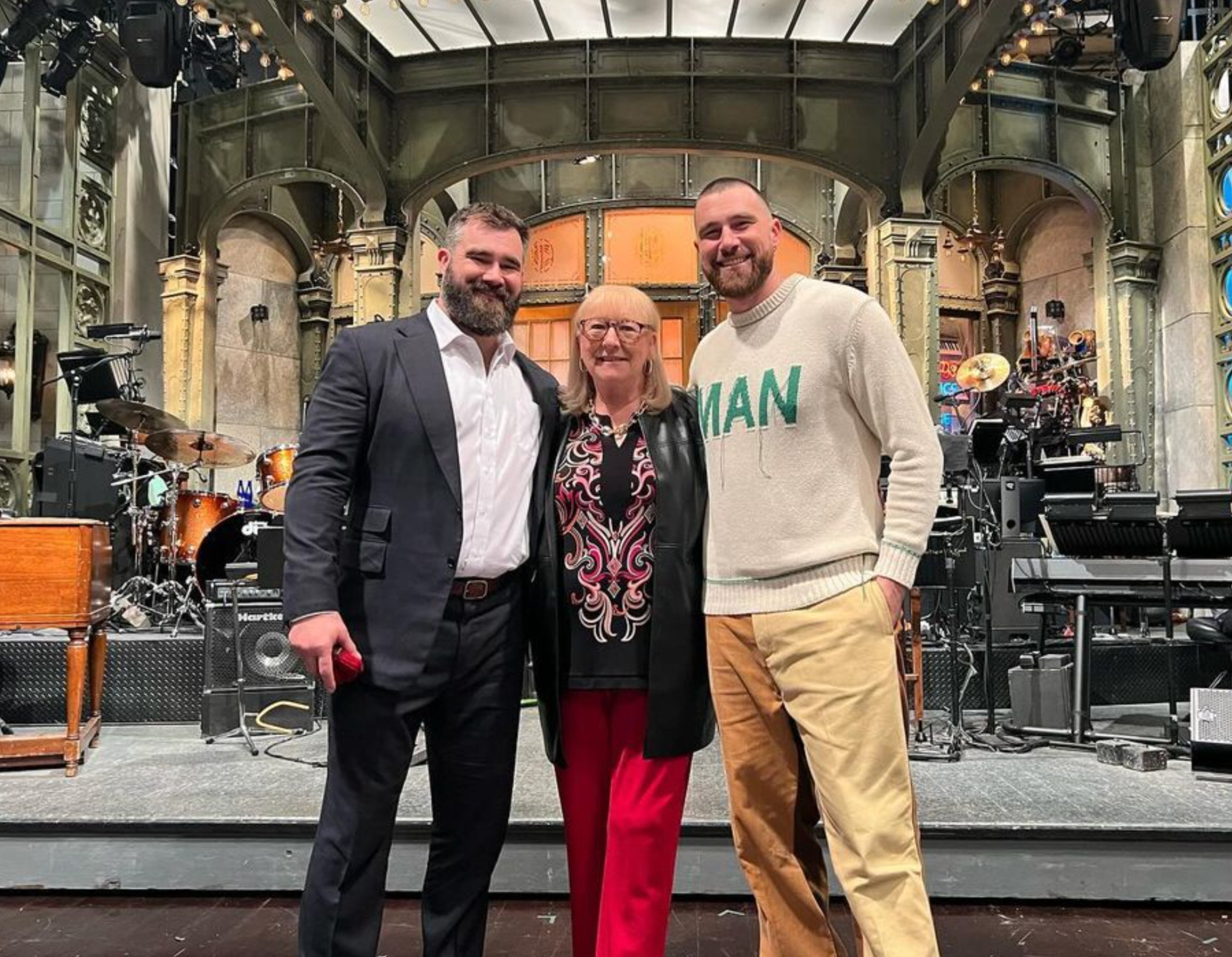 Proud mum Donna Kelce with her sons Jason and Travis Kelce on the SNL stage. Photo: @donnakelce/Instagram 