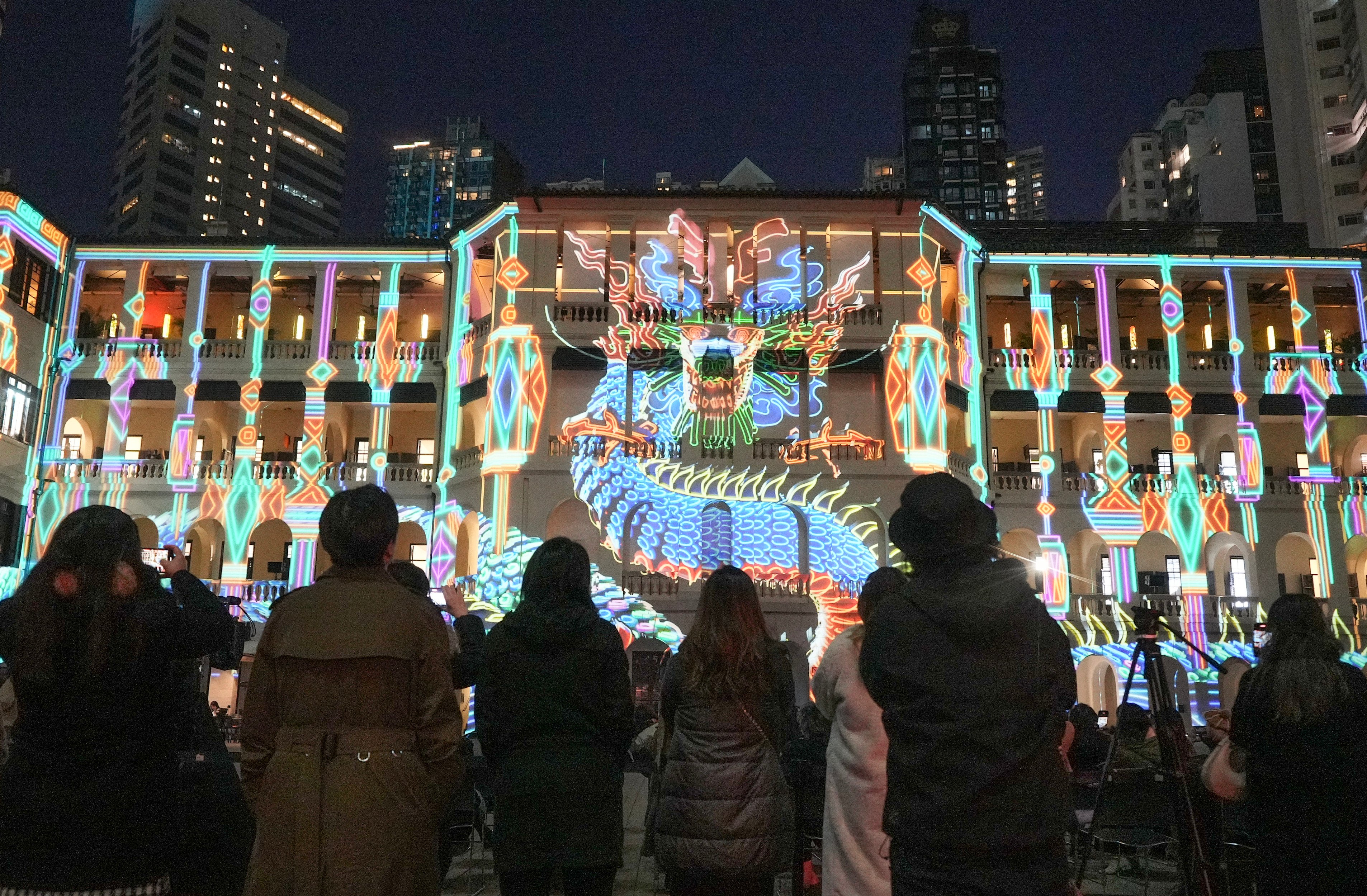 Spectators enjoy the InnerGlow 2024 light show at Tai Kwun, a heritage-arts venue in Central, Hong Kong. Photo: Eugene Lee