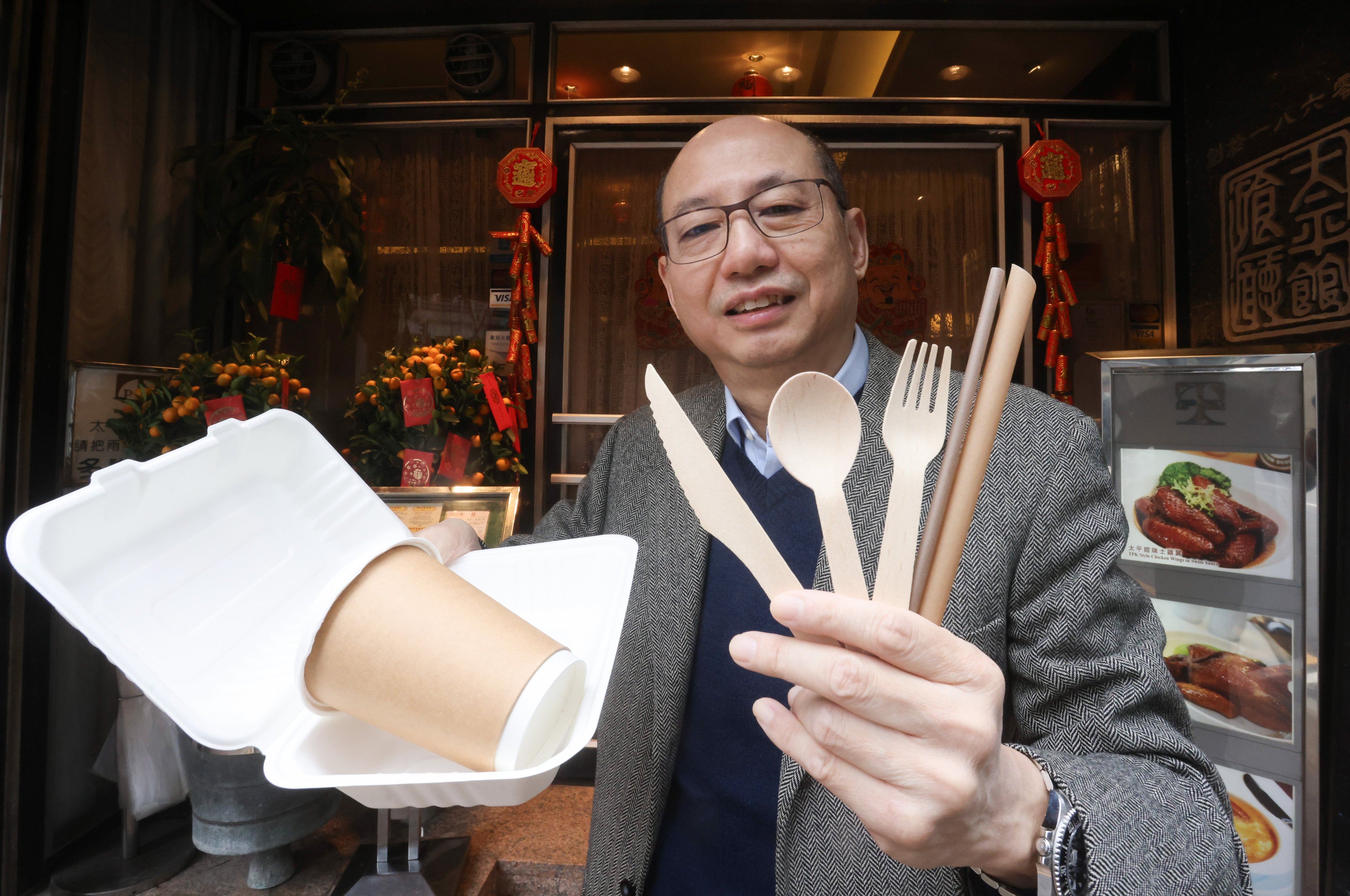 Andrew Chui of the Tai Ping Koon restaurant chain with a variety of disposable, biodegradable items. Photo: Jonathan Wong